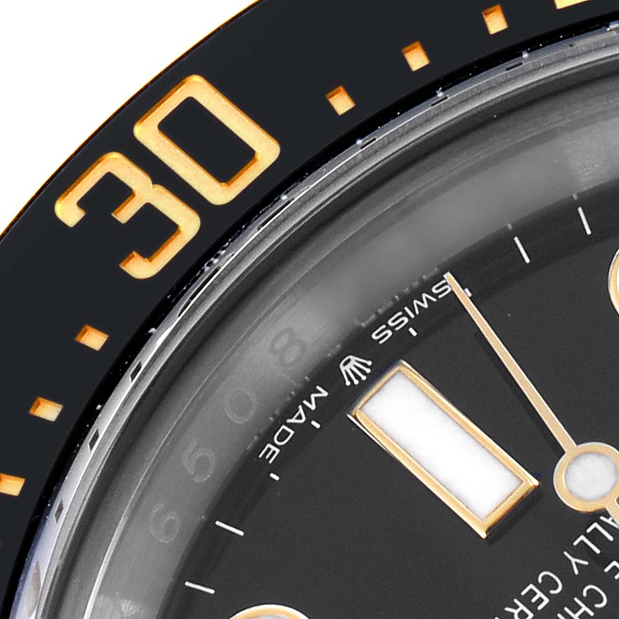 The image shows a close-up of the Rolex Sea-Dweller 126603 Men
s Steel and Gold (two tone) Black Dial
s dial and bezel at an angle highlighting the "30" marker.