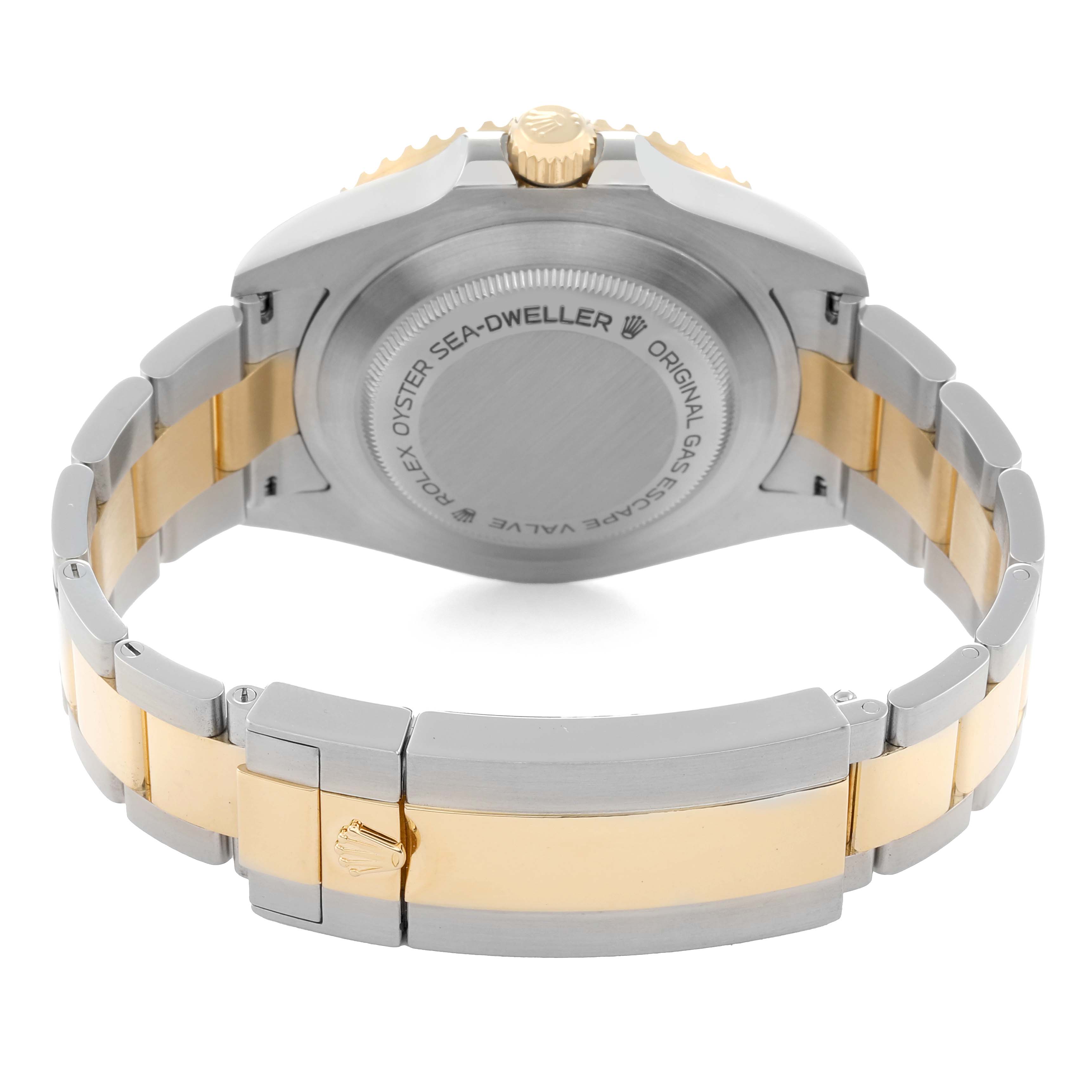 The image shows the back case and bracelet of a Rolex Sea-Dweller 126603 Men
s Steel and Gold (two tone) Black Dial watch at a slight angle, highlighting the clasp and links.