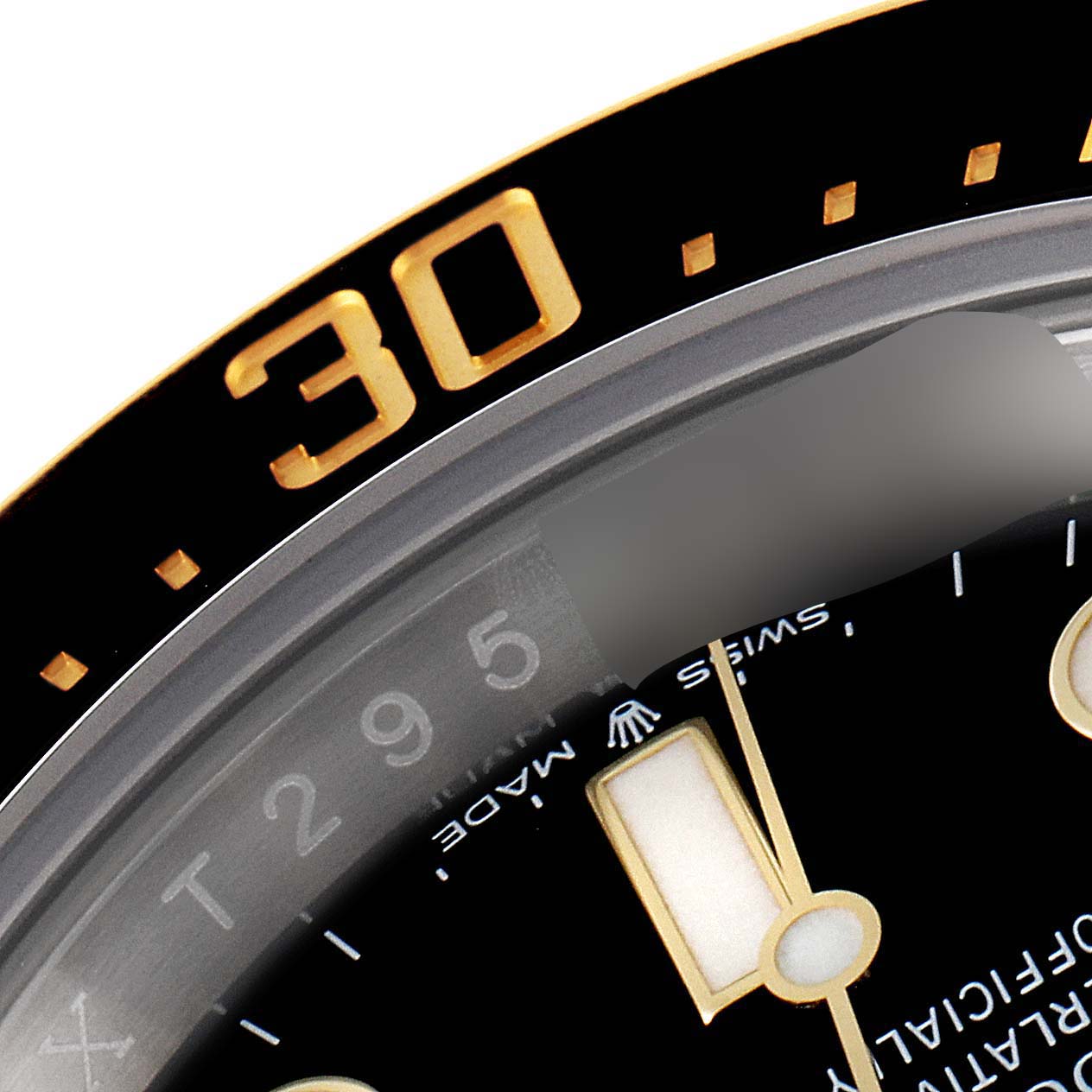 This close-up image shows a partial view of the black bezel with gold accents and part of the dial of the Rolex Sea-Dweller 126603 Men's Steel and Gold (two tone) Black Dial 126603 Men's Steel and Gold (two tone) Black Dial watch.