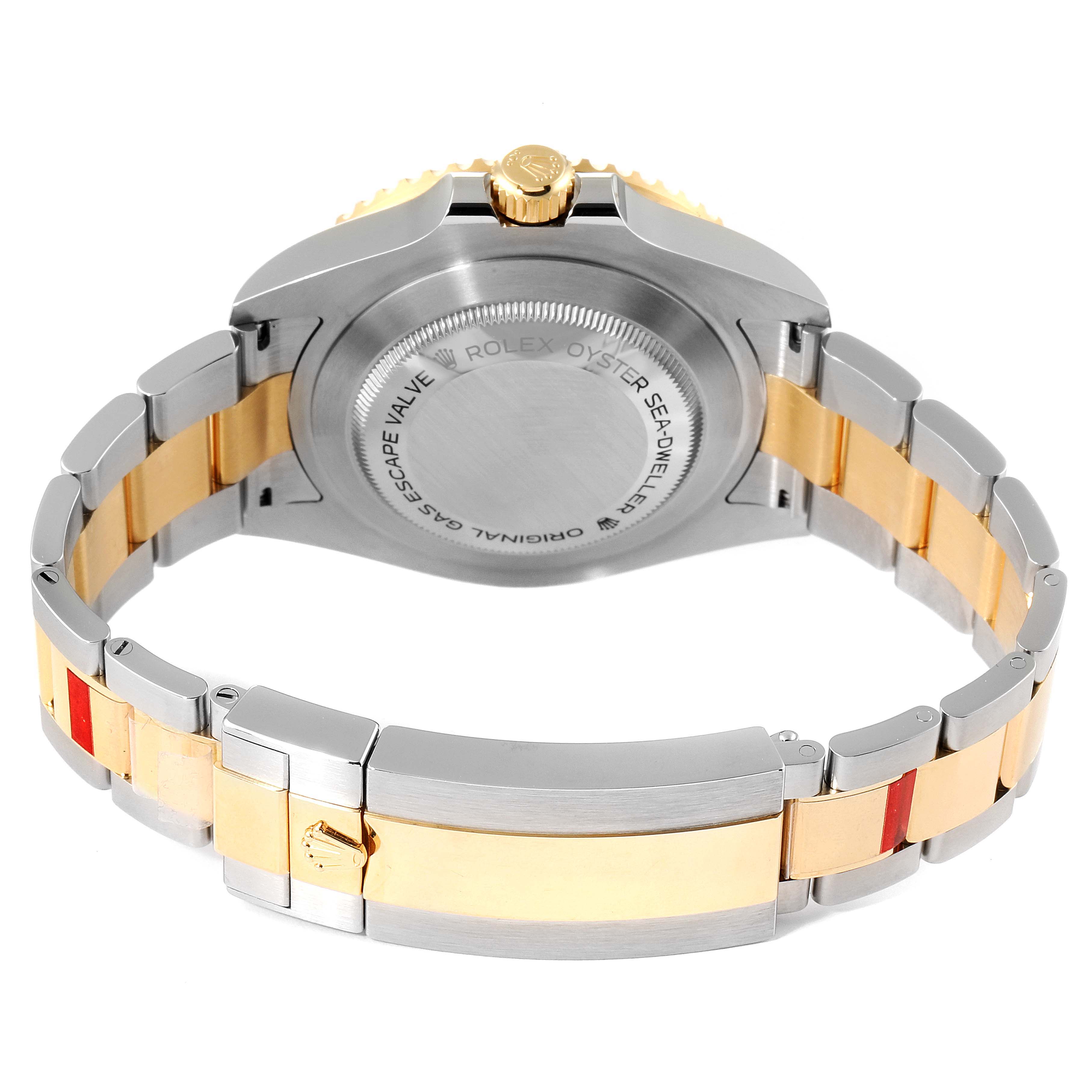 This image shows the back case and bracelet of the Rolex Sea-Dweller 126603 Men's Steel and Gold (two tone) Black Dial 126603 Men's Steel and Gold (two tone) Black Dial watch, highlighting its two-tone design.