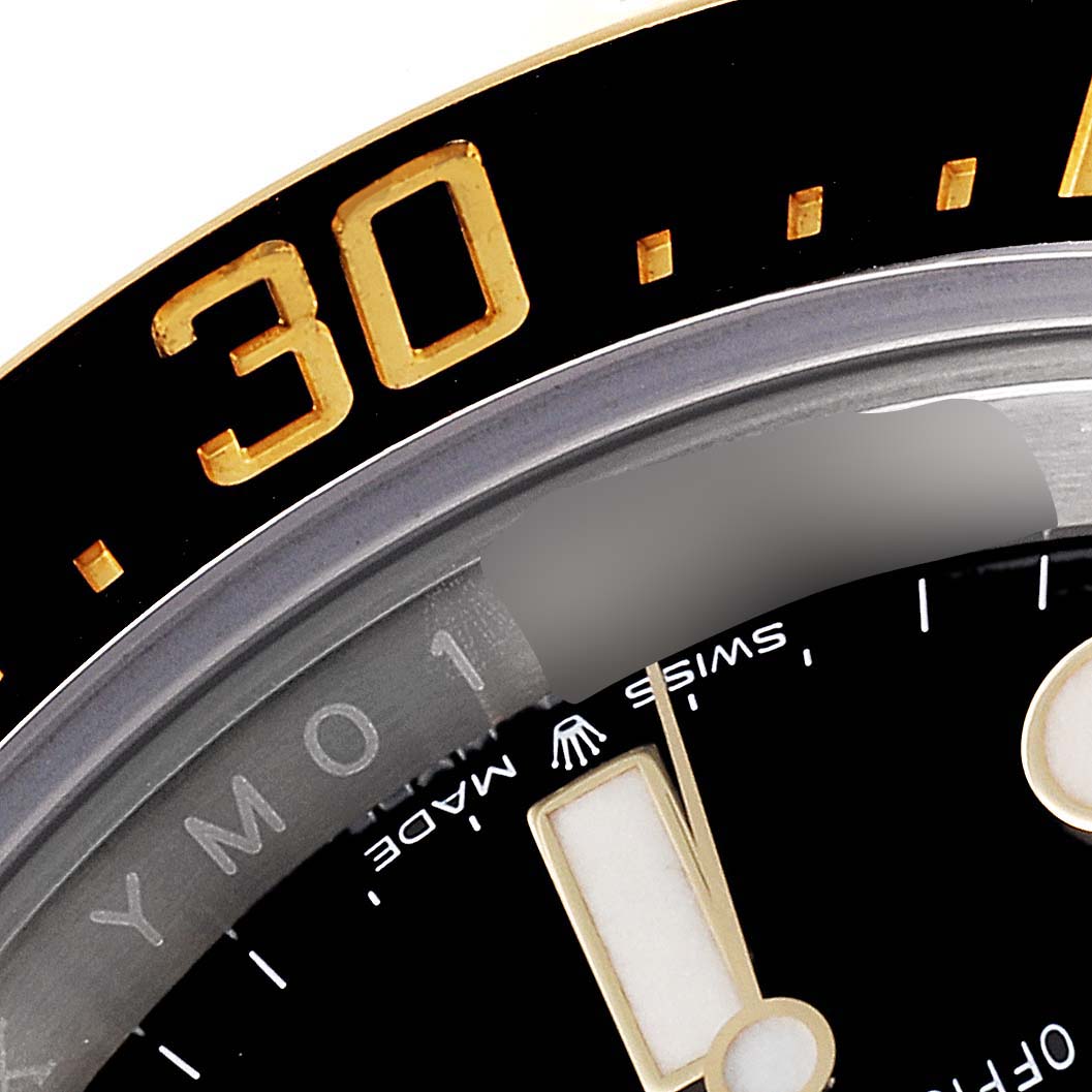 This close-up image shows a portion of the bezel and dial of the Rolex Sea-Dweller 126603 Men's Steel and Gold (two tone) Black Dial 126603 Men's Steel and Gold (two tone) Black Dial watch, highlighting the 30-minute mark and text details.