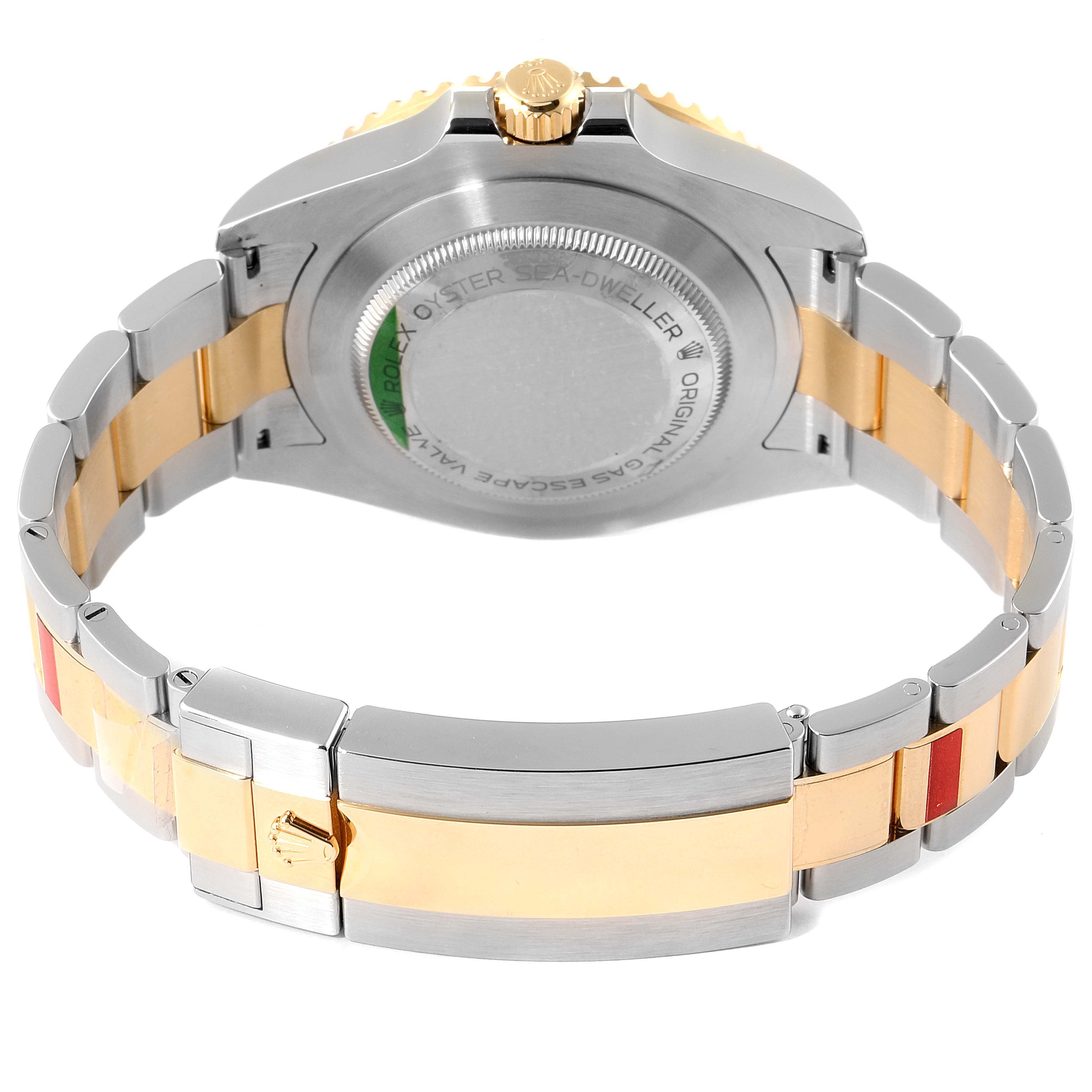 This image shows the back view and bracelet of a Rolex Sea-Dweller 126603 Men's Steel and Gold (two tone) Black Dial 126603 Men's Steel and Gold (two tone) Black Dial model, highlighting the clasp and caseback.