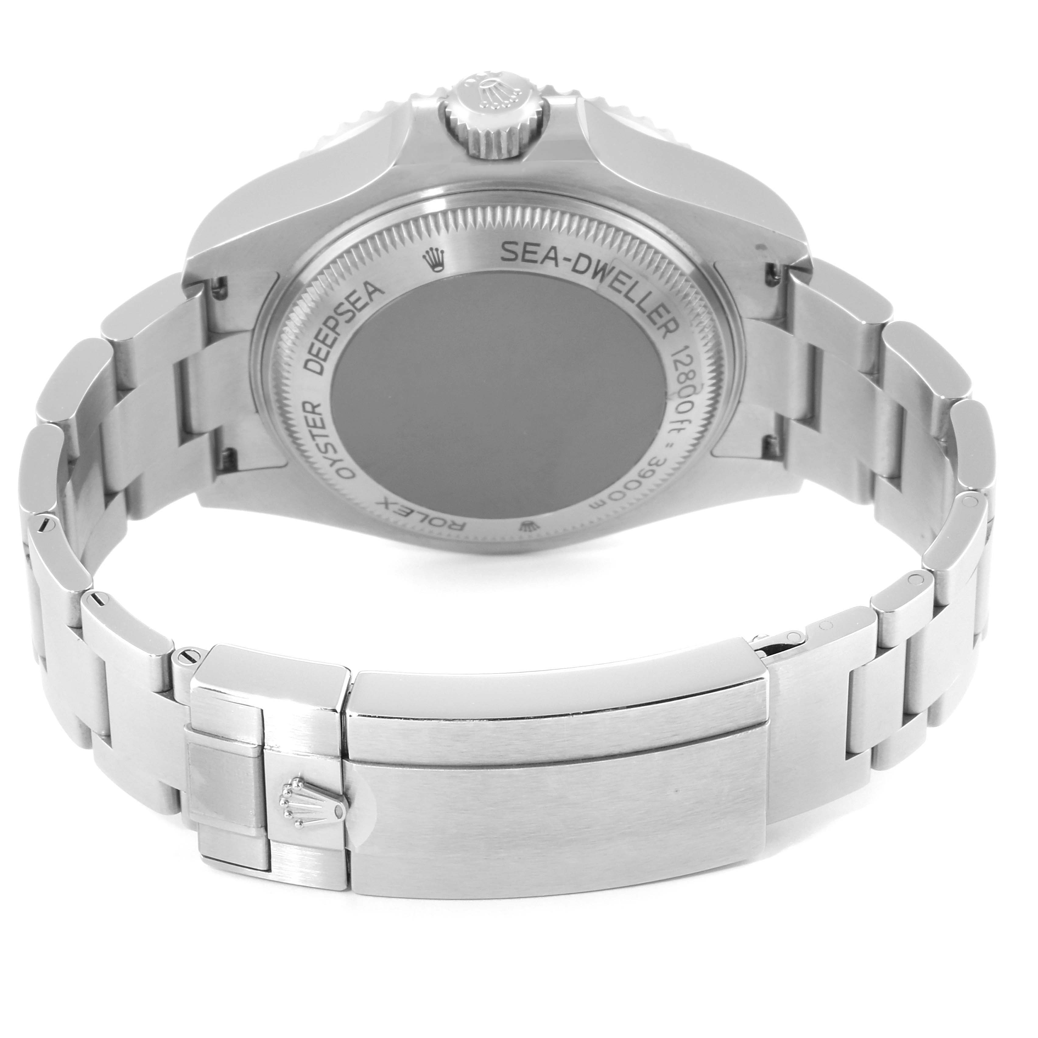 The image shows the back case, crown, and bracelet clasp of a Rolex Sea-Dweller 126660 Men
s Stainless Steel Black Dial 126660 Men
s Stainless Steel Black Dial watch, viewed from the reverse angle.