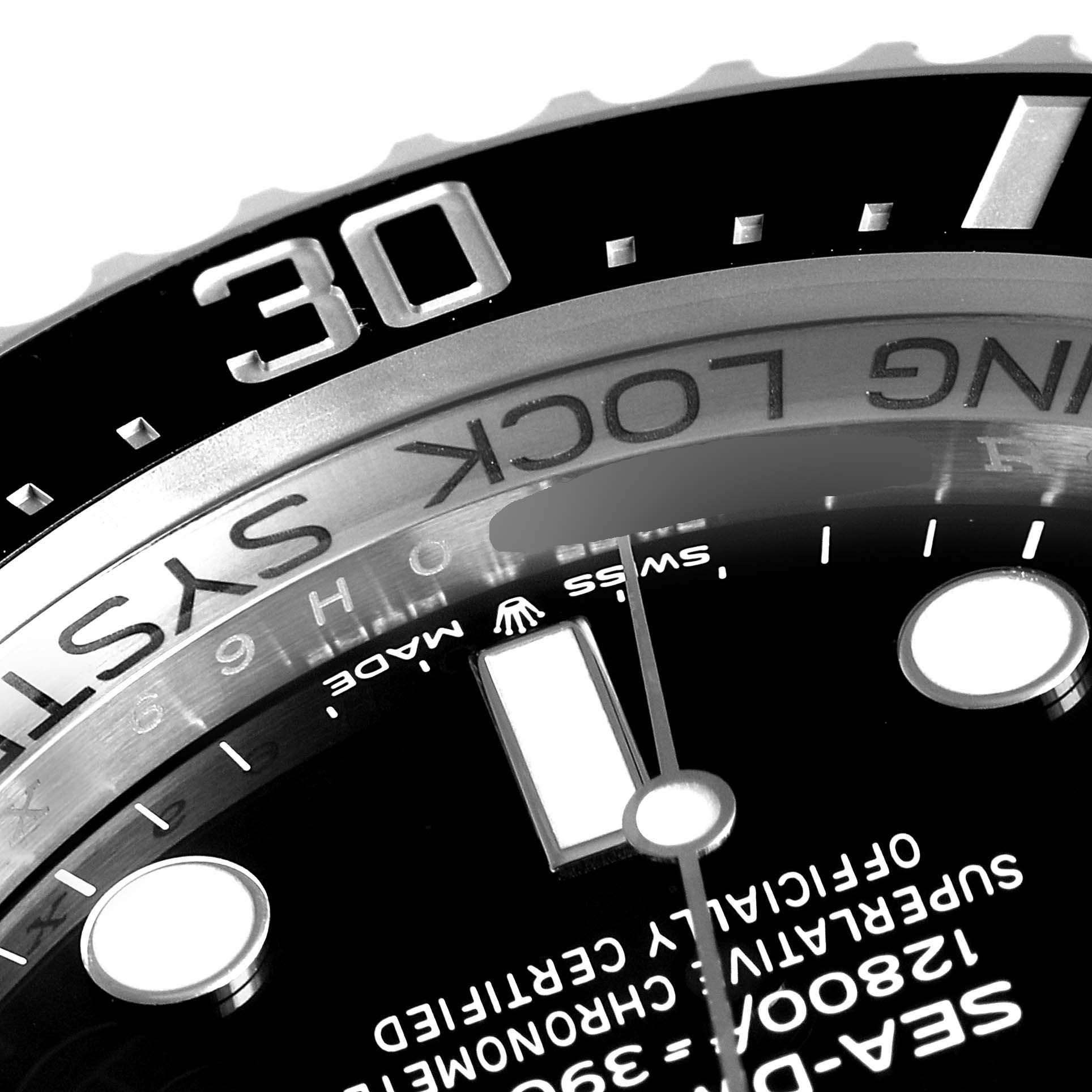 This image shows a close-up of the dial, markers, and part of the bezel of the Rolex Sea-Dweller 126660 Men
s Stainless Steel Black Dial 126660 Men
s Stainless Steel Black Dial watch.