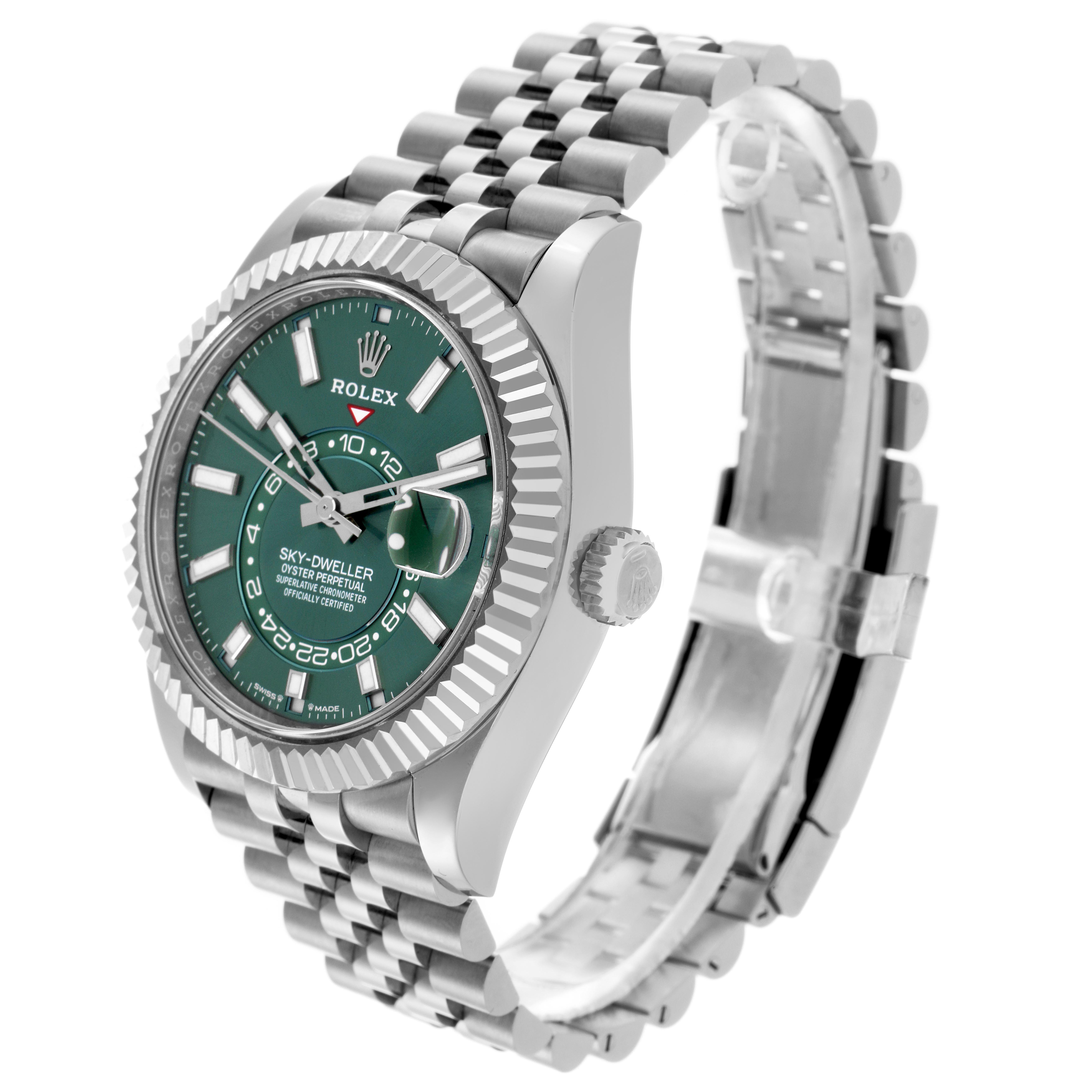 The Rolex Sky-Dweller 336934 Men's Stainless Steel Green Dial watch is shown at a three-quarter angle, highlighting the green dial, bezel, and bracelet.