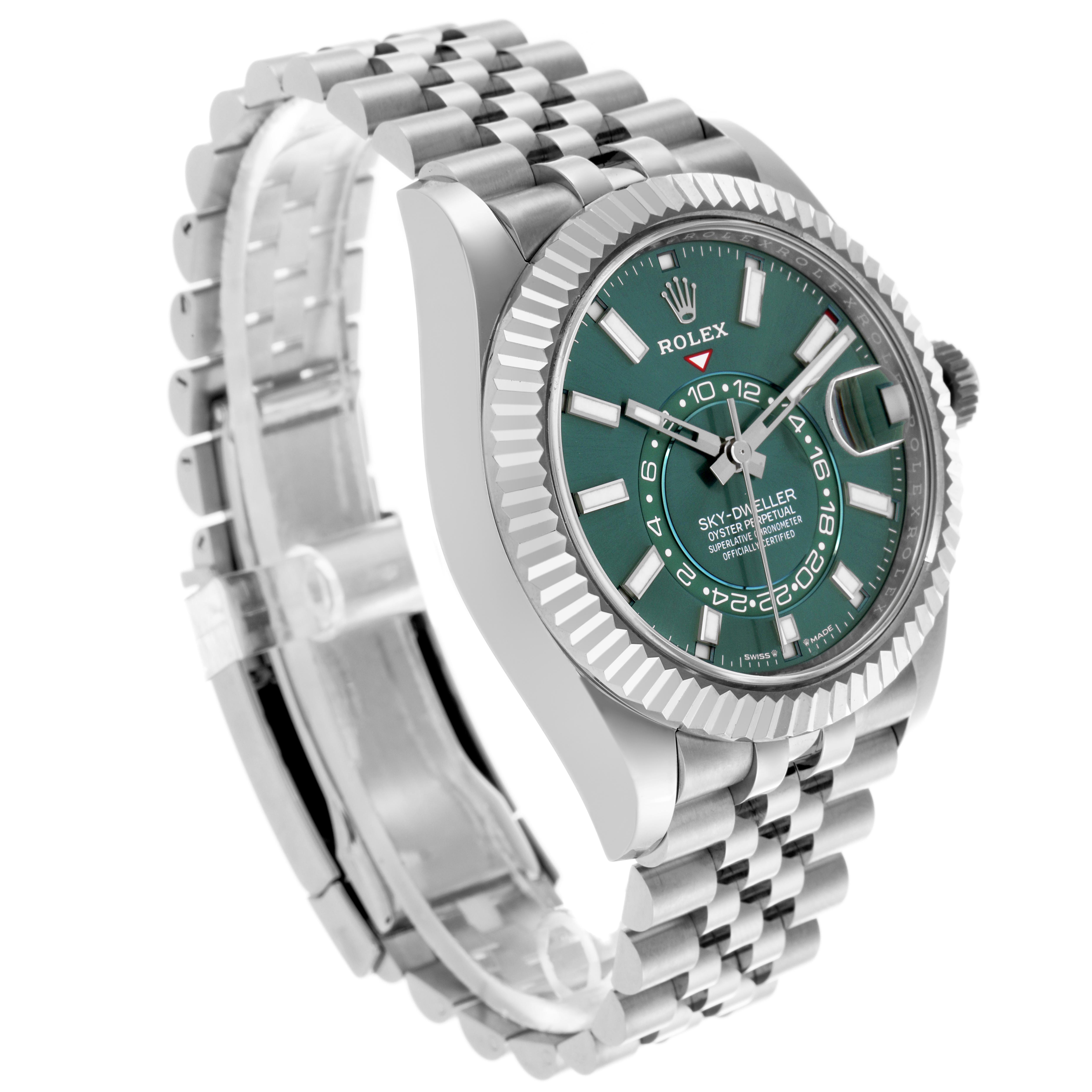 The Rolex Sky-Dweller 336934 Men's Stainless Steel Green Dial watch is shown at an angled side view, highlighting the green dial, bezel, and bracelet.