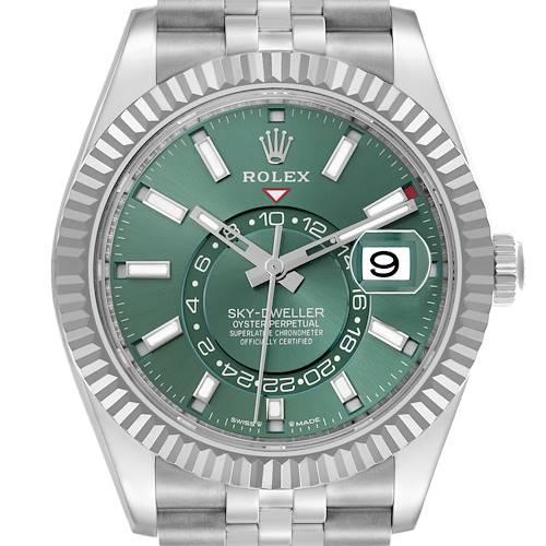 The Rolex Sky-Dweller 336934 Men's Stainless Steel Green Dial watch is shown from a front angle, highlighting its green dial, fluted bezel, and date window.
