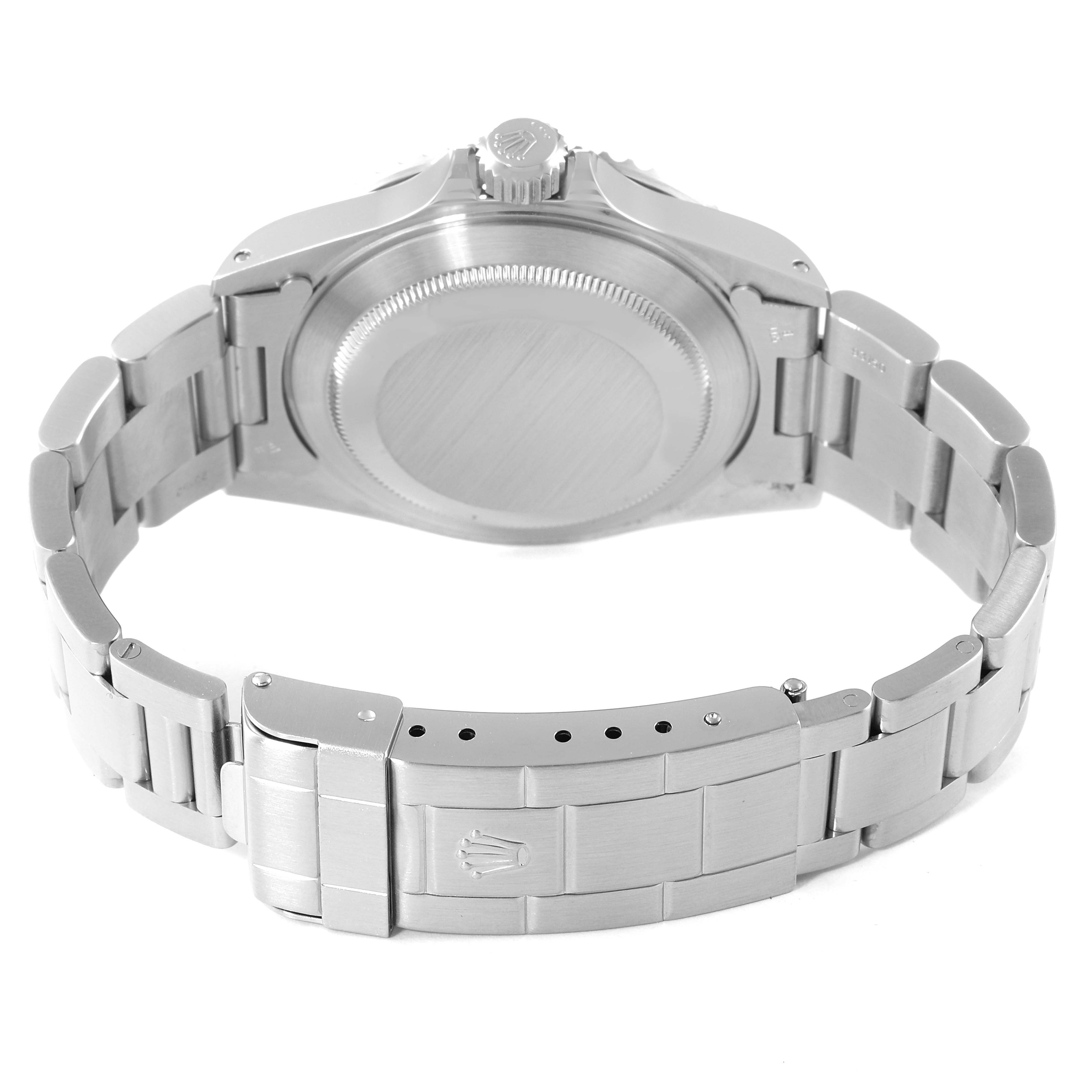 The image shows the back of a Rolex Submariner 14060M Men
s Stainless Steel Black Dial 14060M Men
s Stainless Steel Black Dial watch and its bracelet clasp from a rear angle.