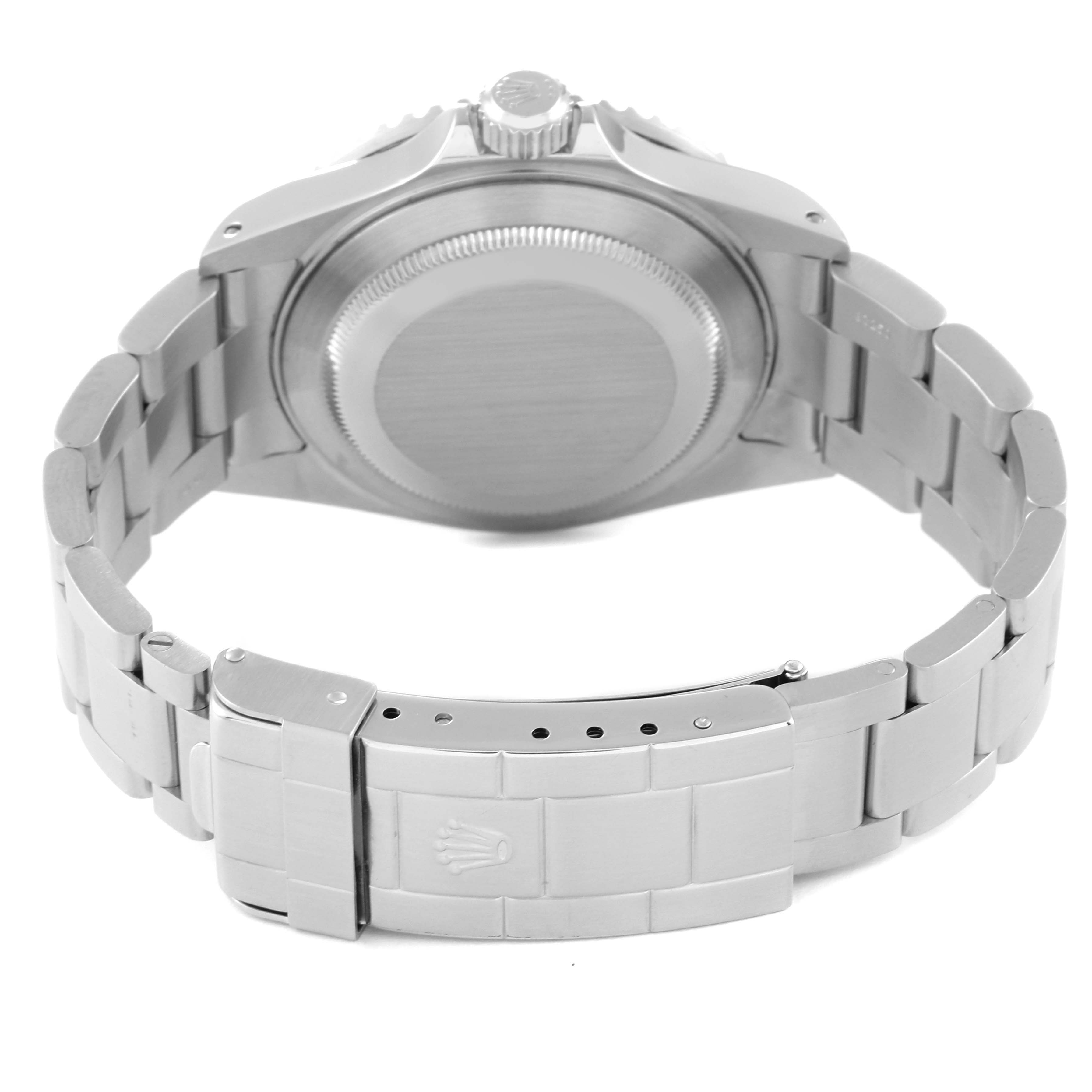 This image shows the backside of a Rolex Submariner 16610 Men
s Stainless Steel Black Dial 16610 Men
s Stainless Steel Black Dial watch, highlighting the case back, bracelet, and the clasp.