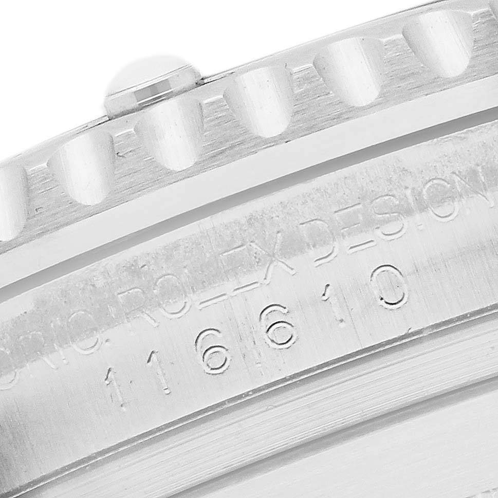 The image shows a close-up of the bezel and model number engraving on a Rolex Submariner 116610LV Men
s Stainless Steel Green Dial watch.