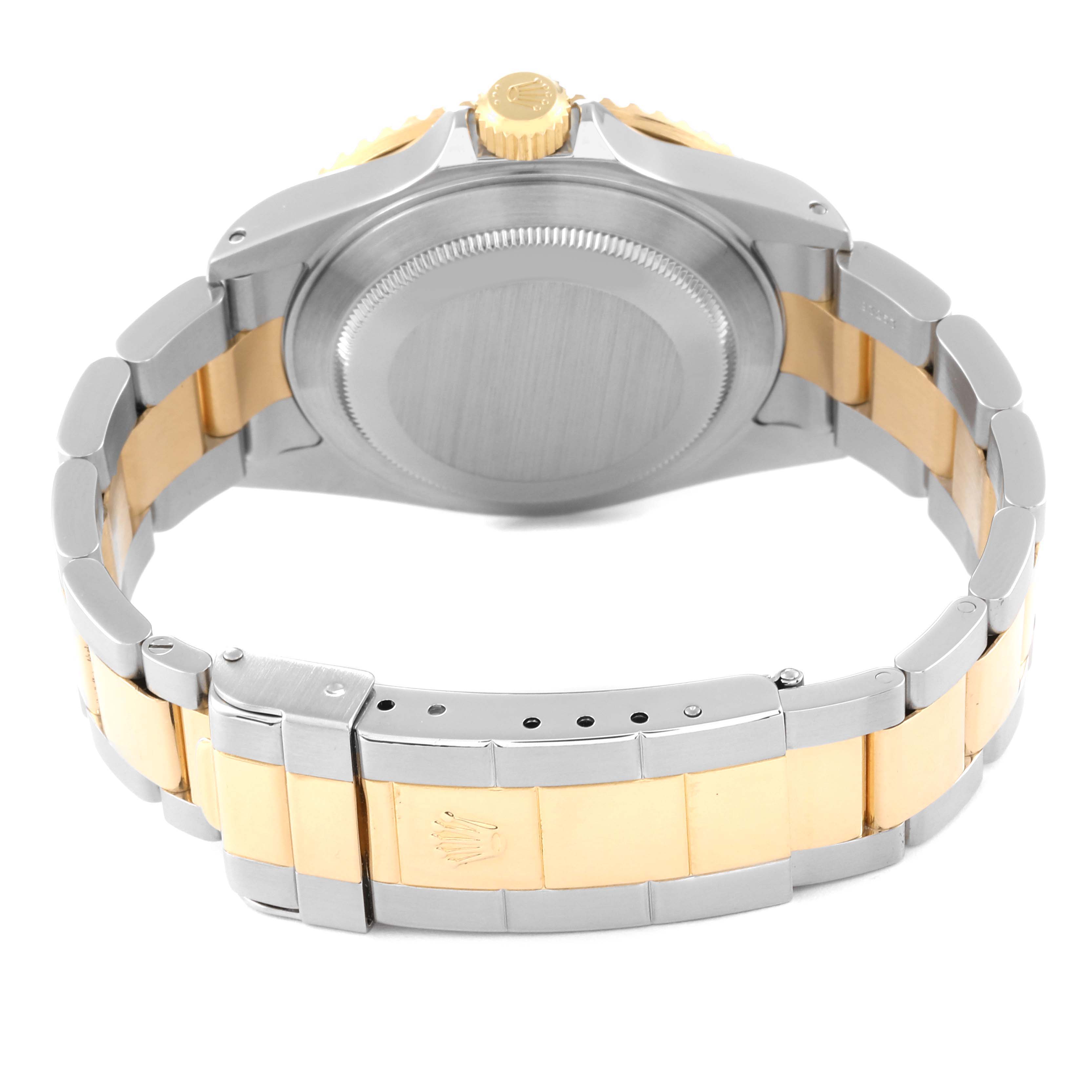 The image shows the back view of a Rolex Submariner 16613 Men's Steel and Gold (two tone) Black Dial 16613 Men's Steel and Gold (two tone) Black Dial, displaying its two-tone bracelet and case back.