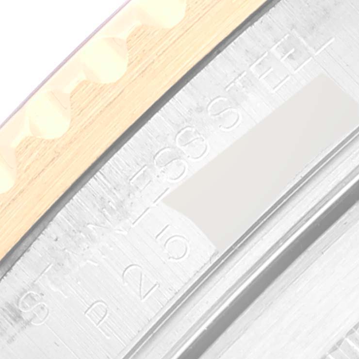 This close-up angle shows the side of the bezel and the serial number engraving on a Rolex Submariner 16613 Men's Steel and Gold (two tone) Black Dial 16613 Men's Steel and Gold (two tone) Black Dial watch.