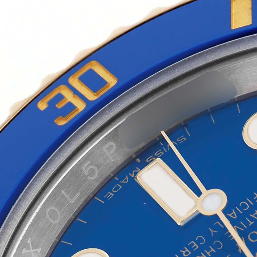 The image shows a close-up of the bezel and dial of a Rolex Submariner 116613LB Men's Steel and Gold (two tone) Blue Dial, highlighting the blue "30" marker.