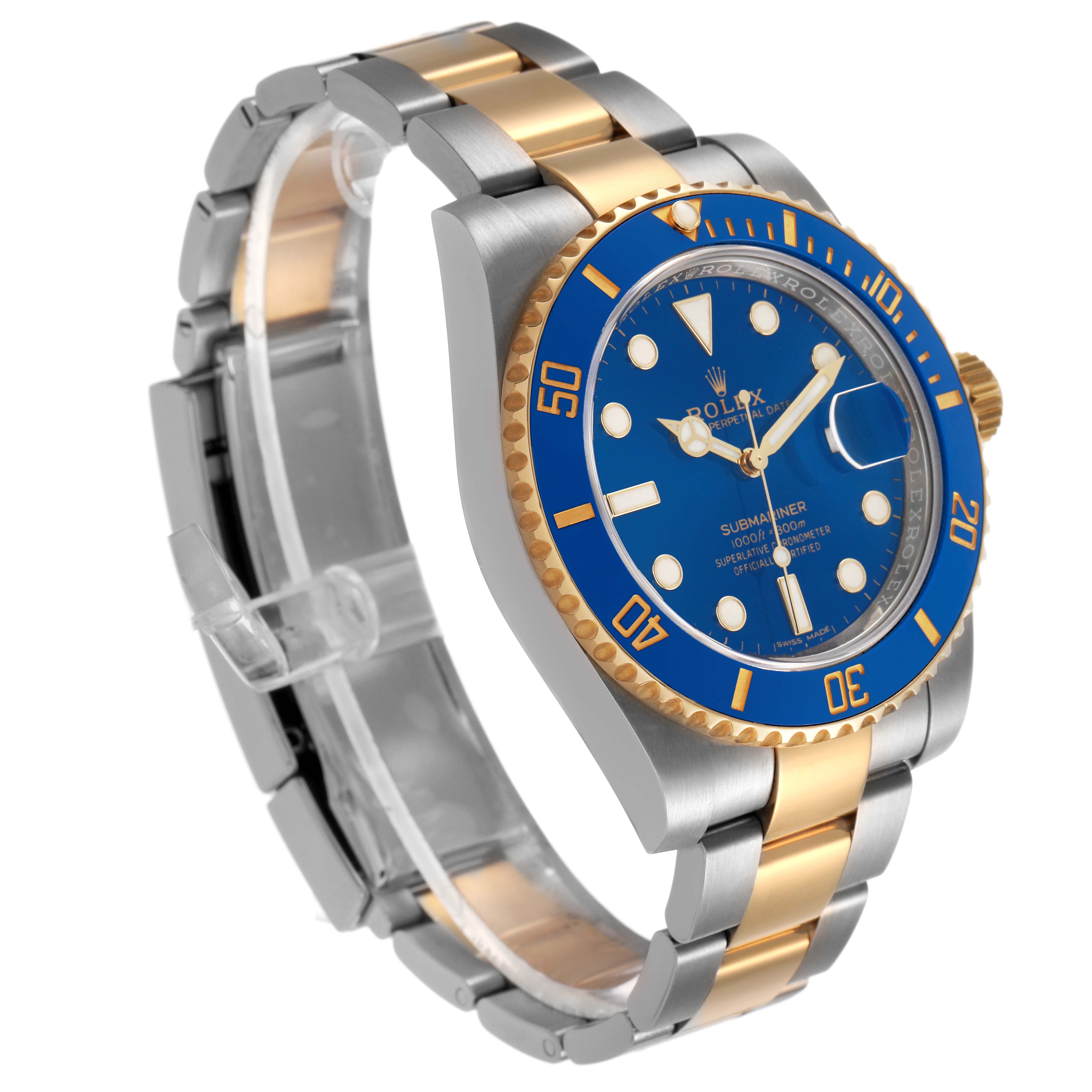 The Rolex Submariner 116613LB Men's Steel and Gold (two tone) Blue Dial is shown at a three-quarter angle, highlighting the blue dial, bezel, and the two-tone bracelet.