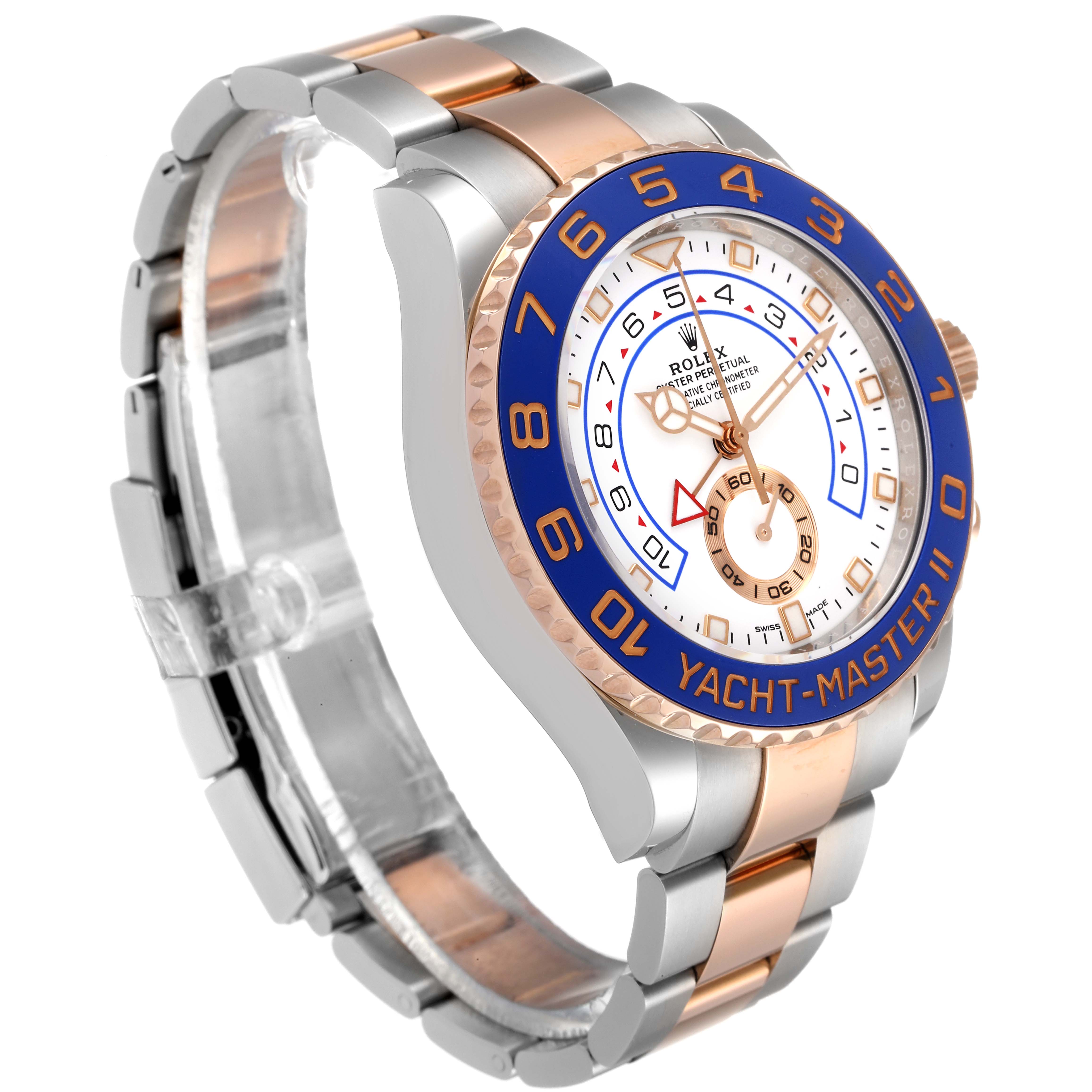The Rolex Yacht-Master 116681 Men
s Steel and Gold (two tone) White Dial 116681 Men
s Steel and Gold (two tone) White Dial watch is shown at a three-quarter angle, highlighting its face, steel and rose gold bracelet, and blue bezel.