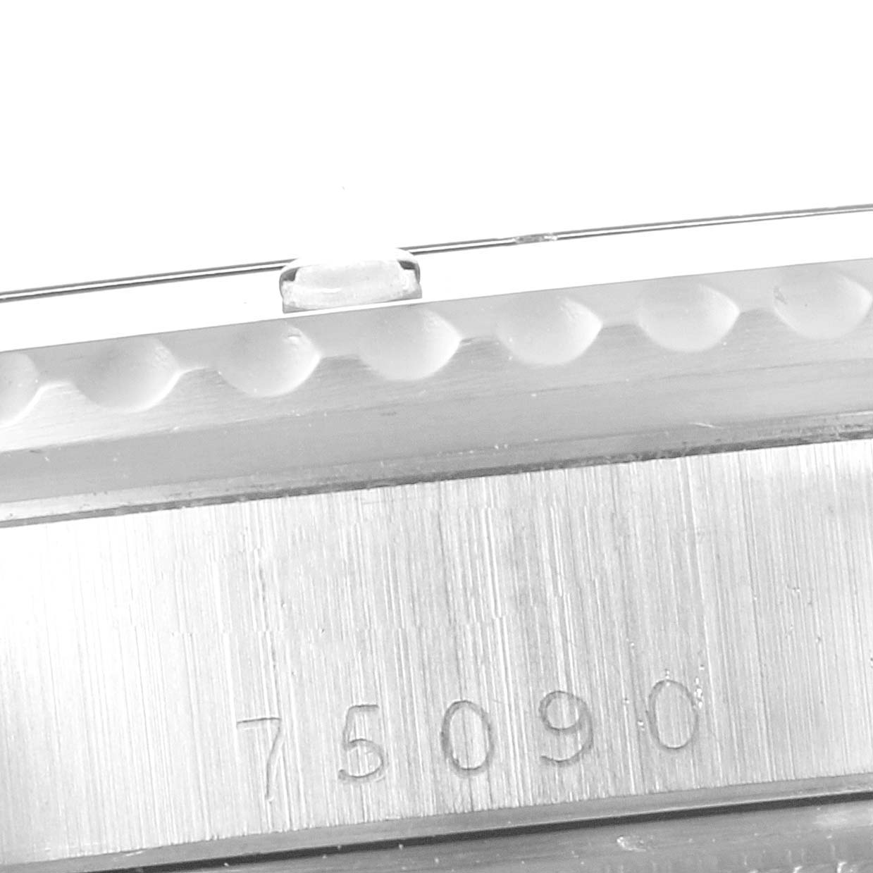 This close-up image shows the side view of the case and bezel of a Tudor Submariner 75090 Men
s Stainless Steel Black Dial 75090 Men
s Stainless Steel Black Dial watch, with "75090" engraved on the case.