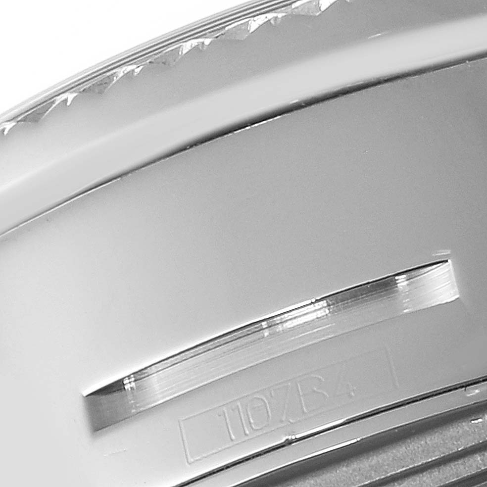 This close-up image of the Breitling Bentley P19362 Men's Stainless Steel Mother of Pearl Dial P19362 Men's Stainless Steel Mother of Pearl Dial model watch shows a portion of the bezel and engraved serial number.