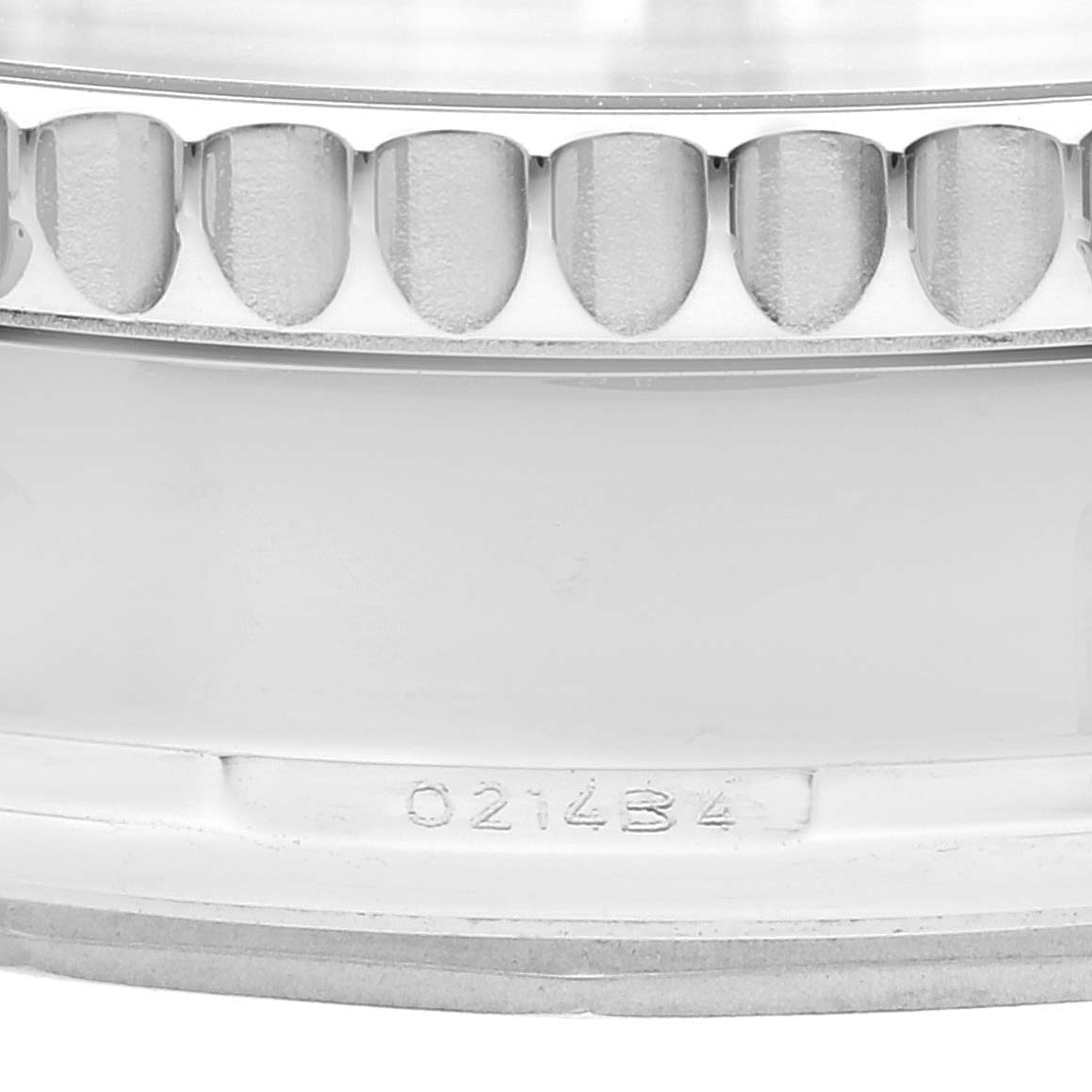 This close-up image shows the bezel and part of the caseback with a serial number of a Breitling Navitimer AB0130C5-C894-448A Men's Stainless Steel Blue Dial AB0130C5-C894-448A Men's Stainless Steel Blue Dial watch.