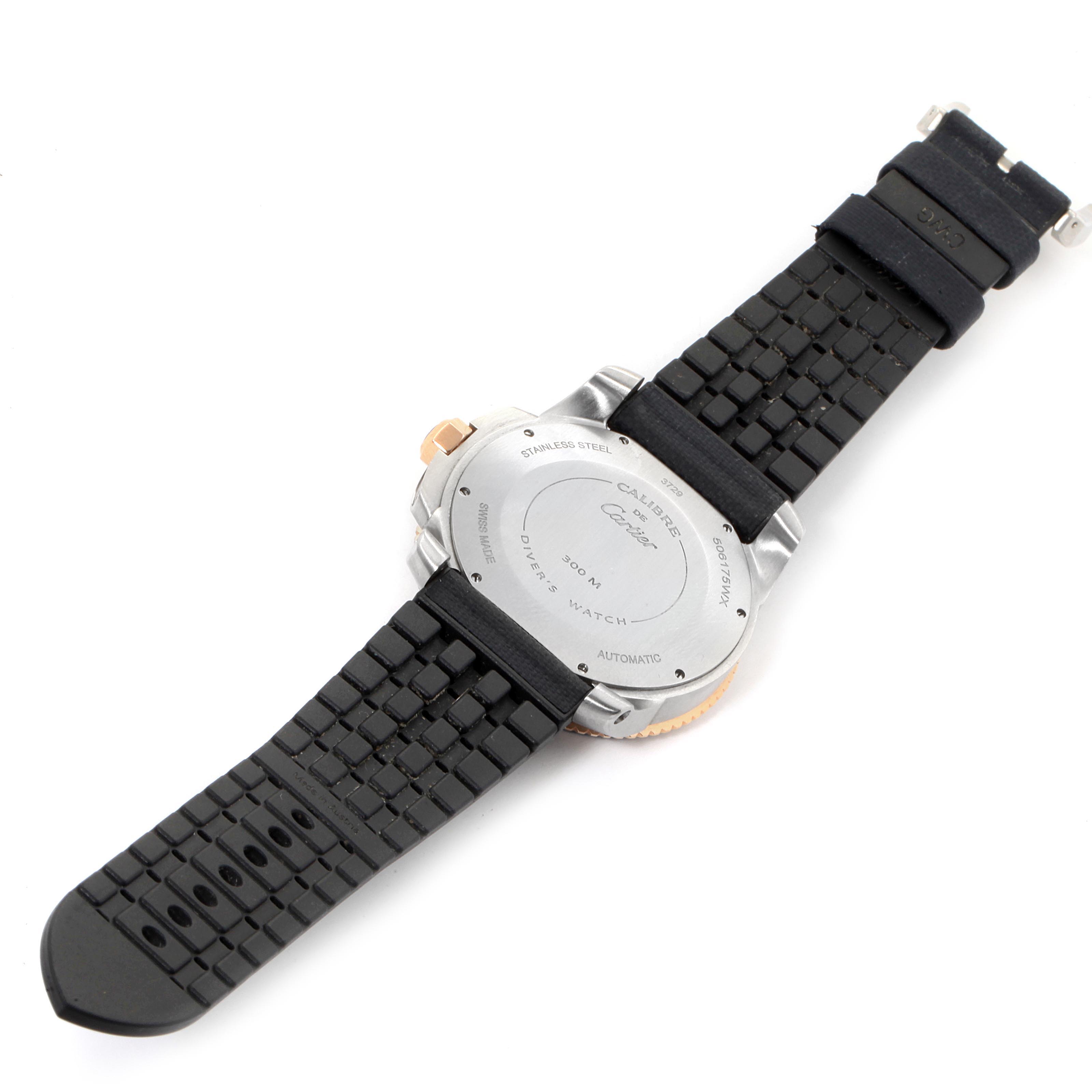 The image shows the back and part of the black strap of the Calibre de Cartier watch by Cartier.