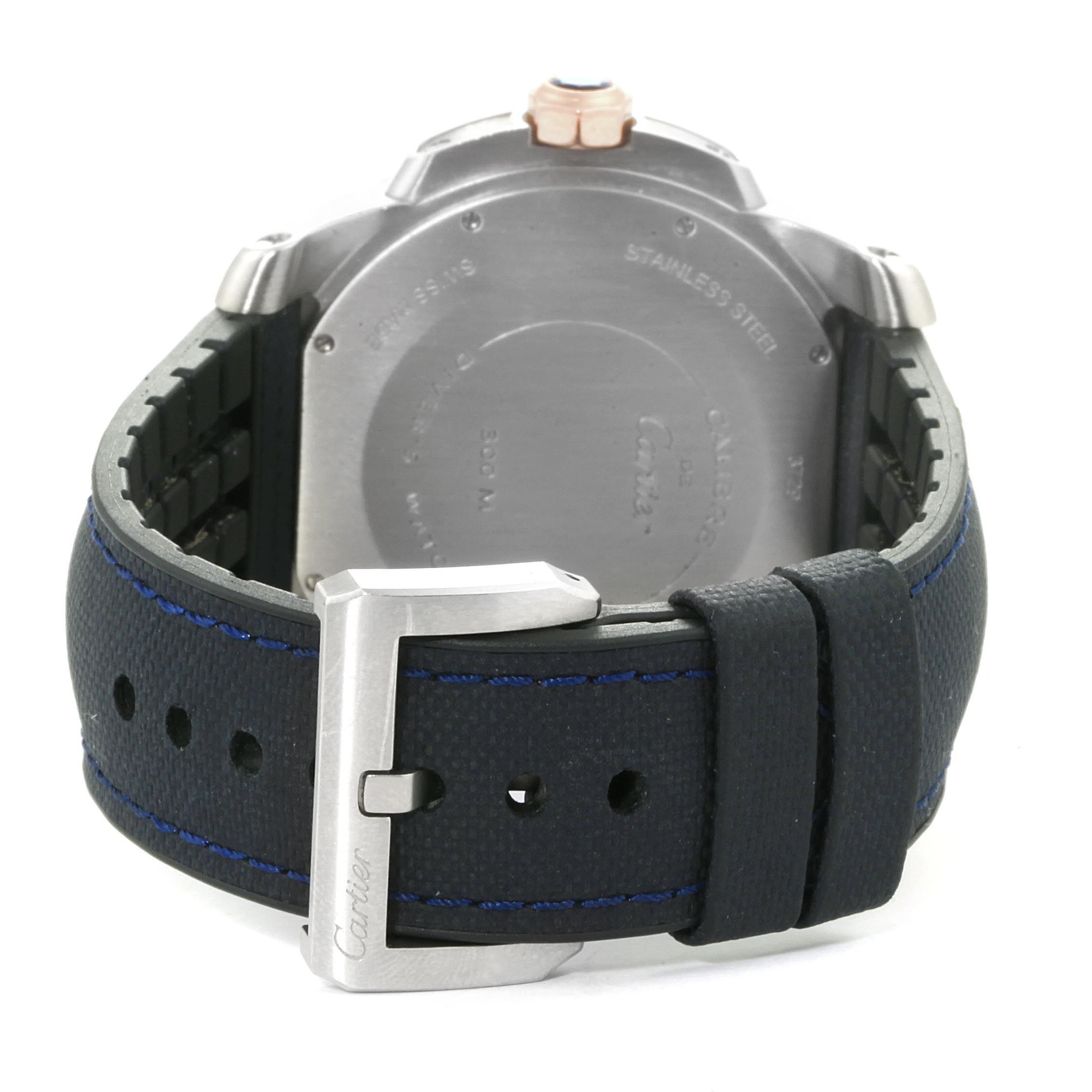 The image shows the back view of a Calibre de Cartier watch with its case back and leather strap with a buckle.