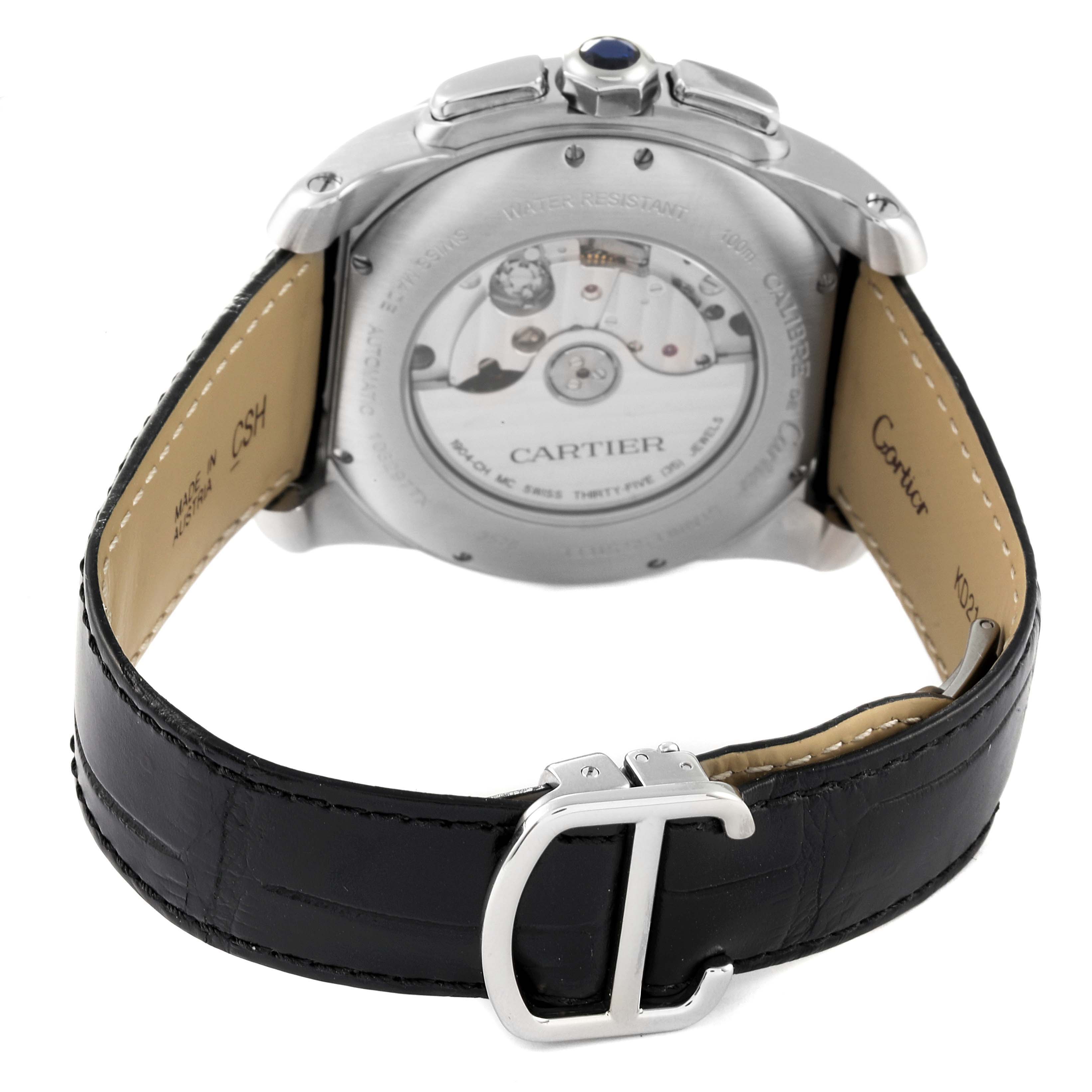 This image shows the rear and side view of a Calibre de Cartier watch by Cartier, focusing on the movement and leather strap with the Cartier buckle.