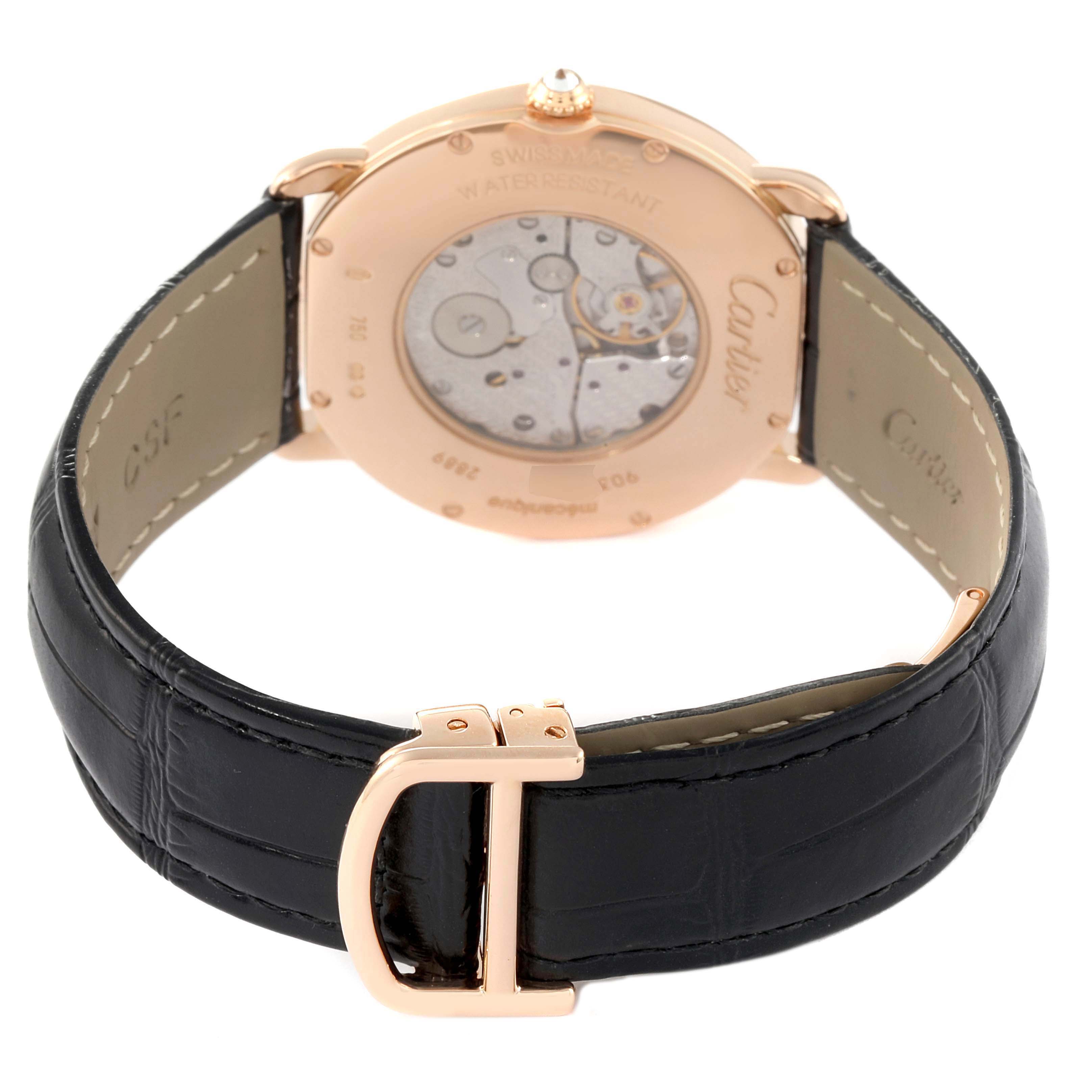 The image shows the back of the Cartier Tank Louis WR000651 Women's Rose Gold Silver Dial watch, emphasizing its movement, case back, and leather strap buckle.