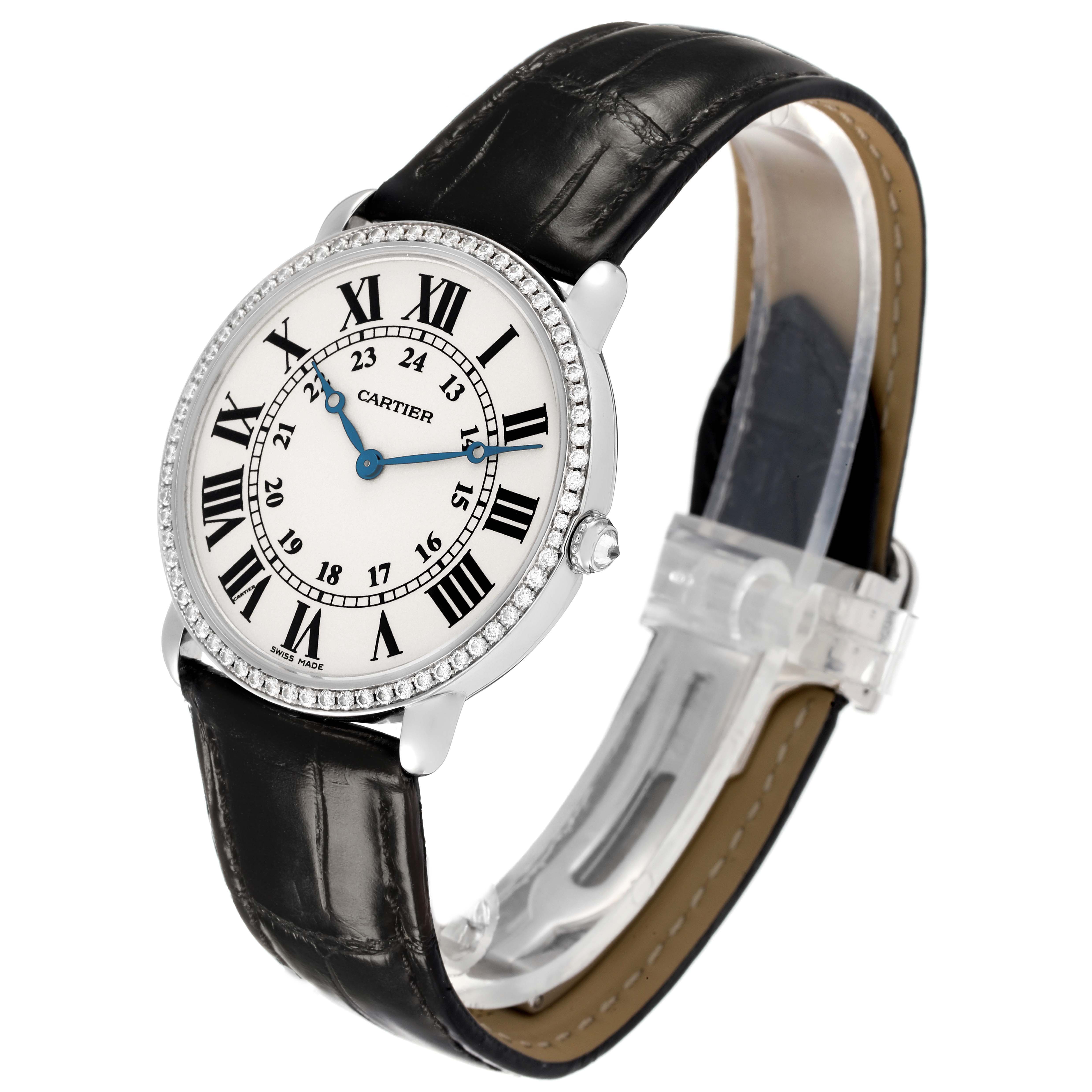 The Cartier Ronde WR000551 Women's White Gold Silver Dial watch is shown from a three-quarter angle, highlighting the dial, bezel, and leather strap.