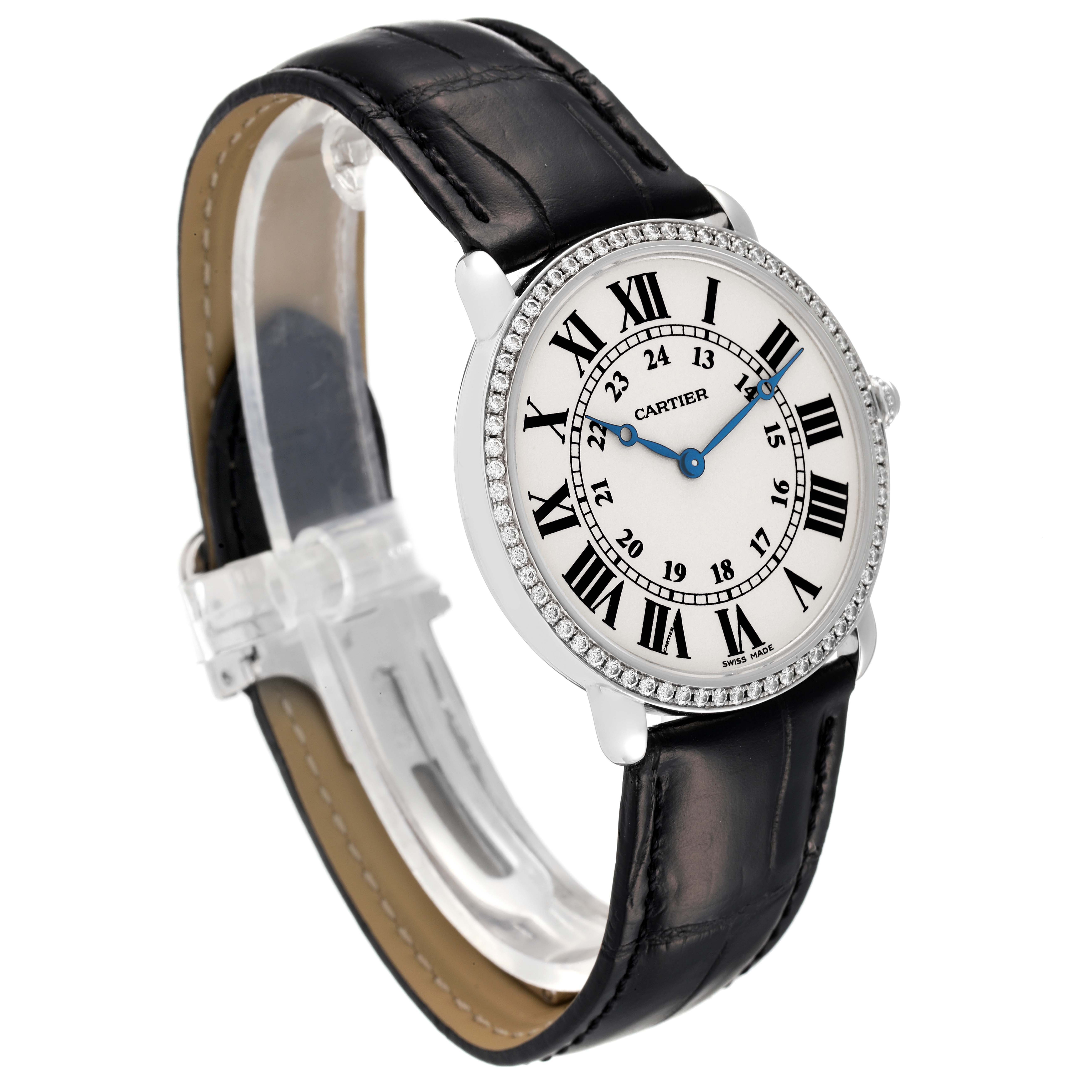 The Cartier Ronde WR000551 Women's White Gold Silver Dial WR000551 Women's White Gold Silver Dial watch is shown at a slight angle, highlighting its round face, Roman numerals, and black leather strap.