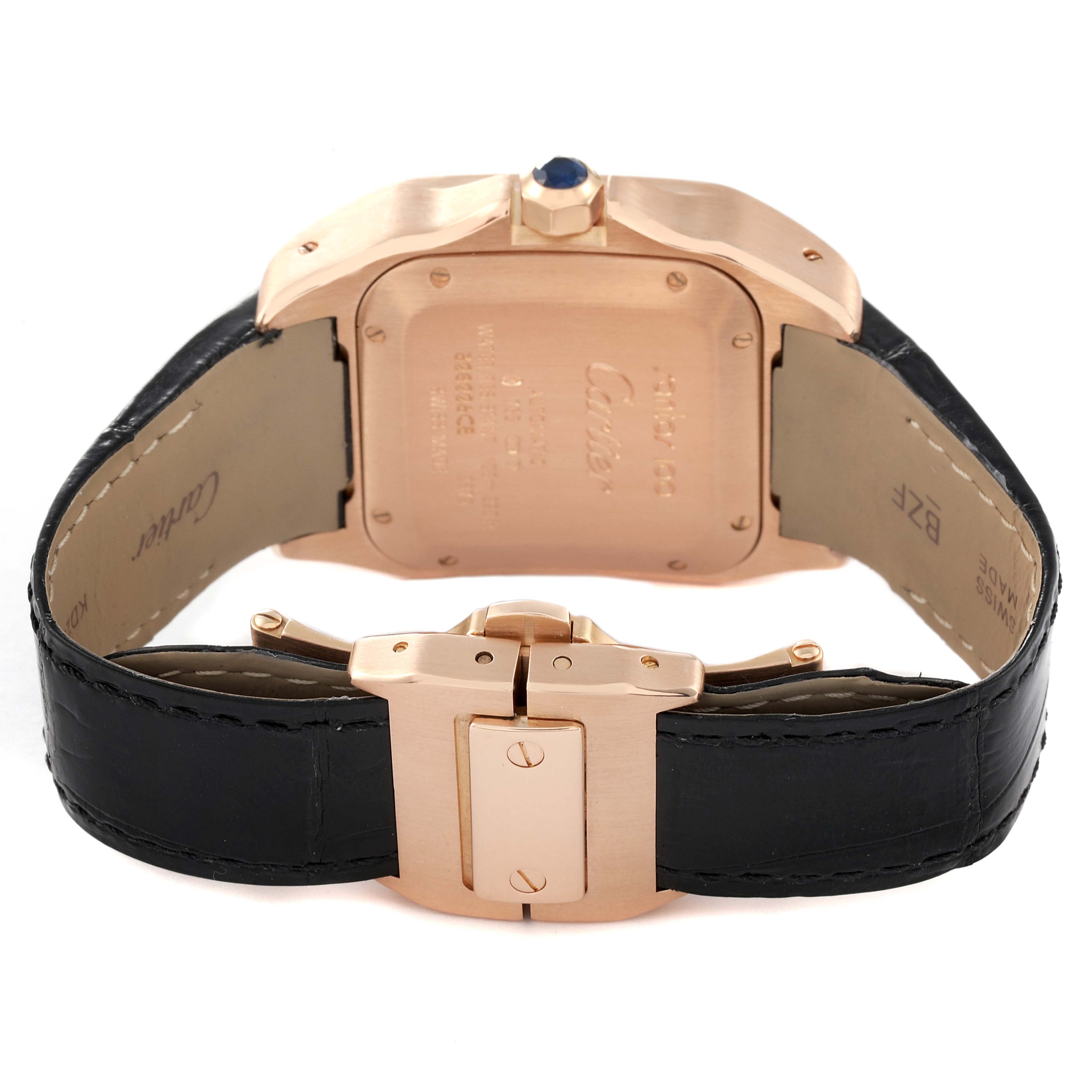 This image shows the back and clasp of a Cartier Santos W20108Y1 Men
s Rose Gold Silver Dial W20108Y1 Men
s Rose Gold Silver Dial model watch with a black leather strap.