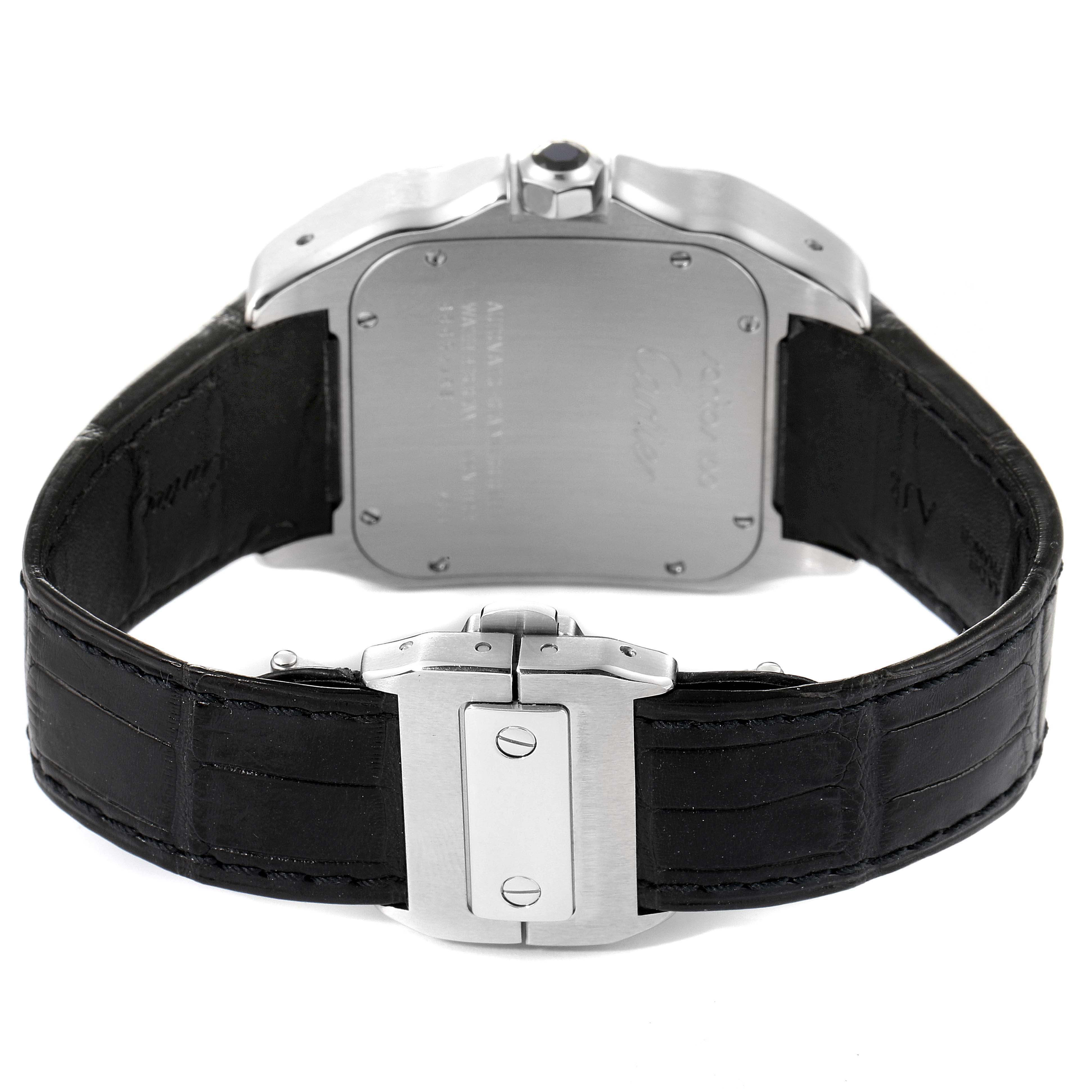 This image shows the back of a Santos model by Cartier, focusing on the case back, crown, and clasp of the leather strap.
