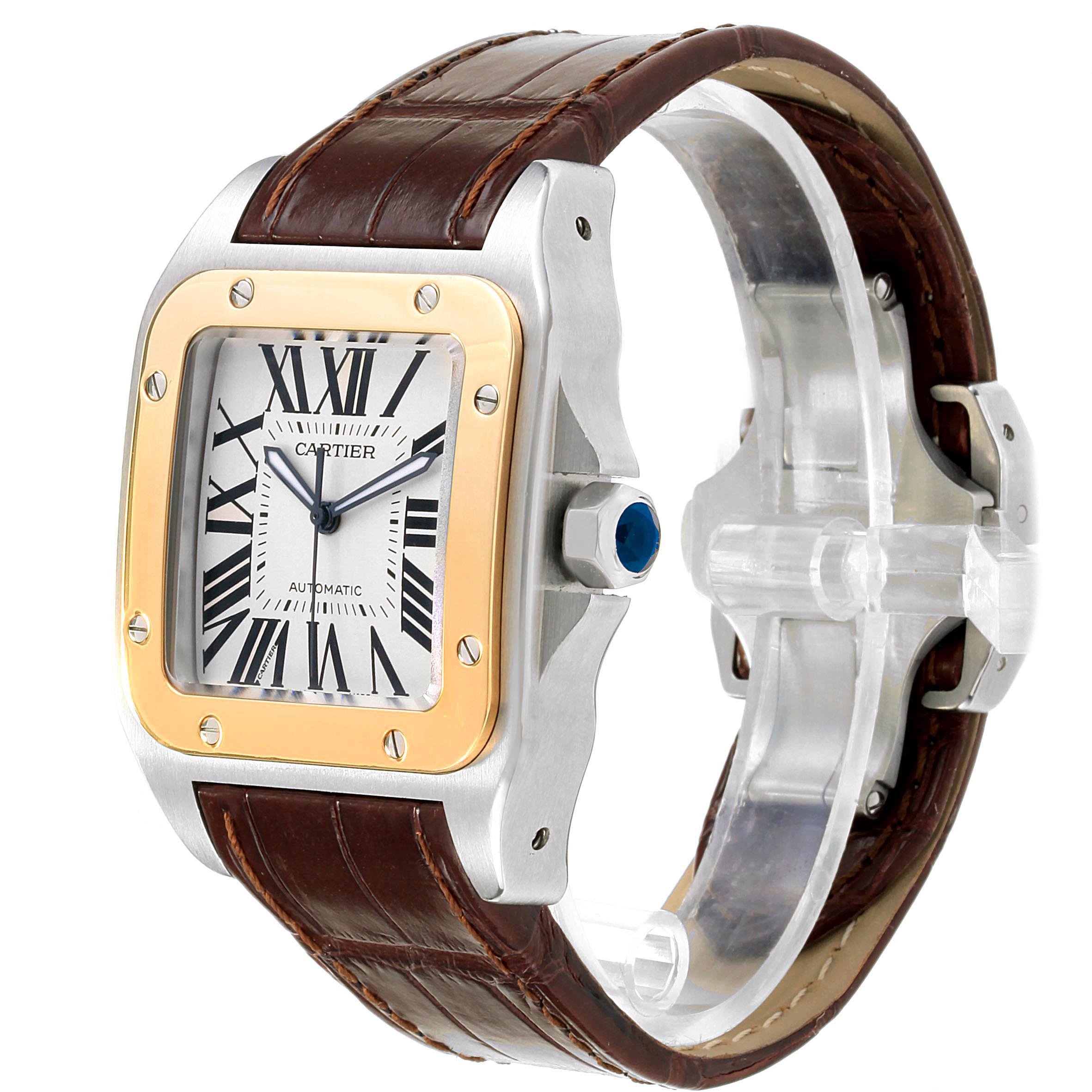 The Cartier Santos W20072X7 Men's Steel and Gold (two tone) Silver Dial W20072X7 Men's Steel and Gold (two tone) Silver Dial watch is shown at a slight angle, displaying its square face, gold bezel, and brown leather strap.