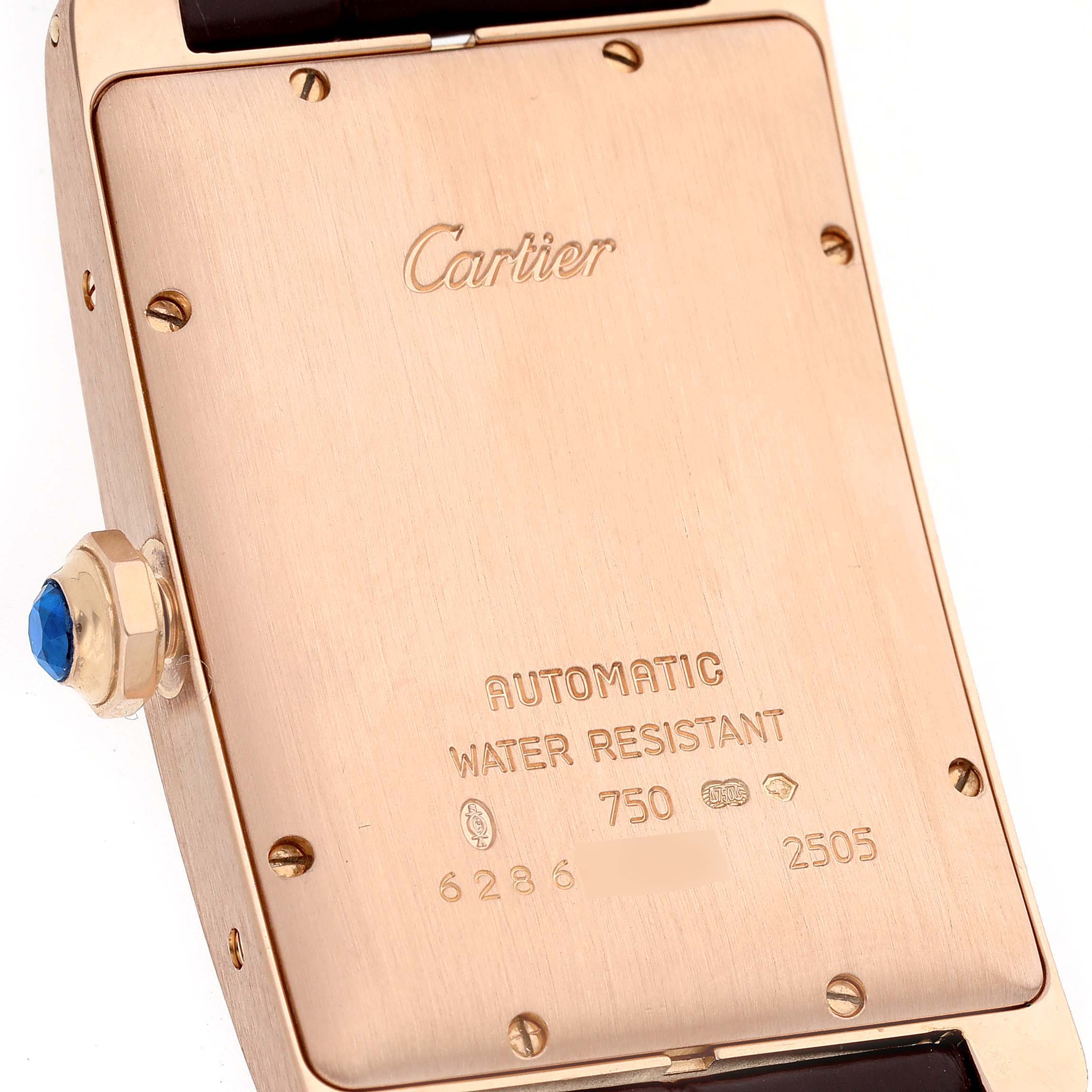 This image shows the back view of the Tank Americaine model by Cartier, focusing on the case back and crown.