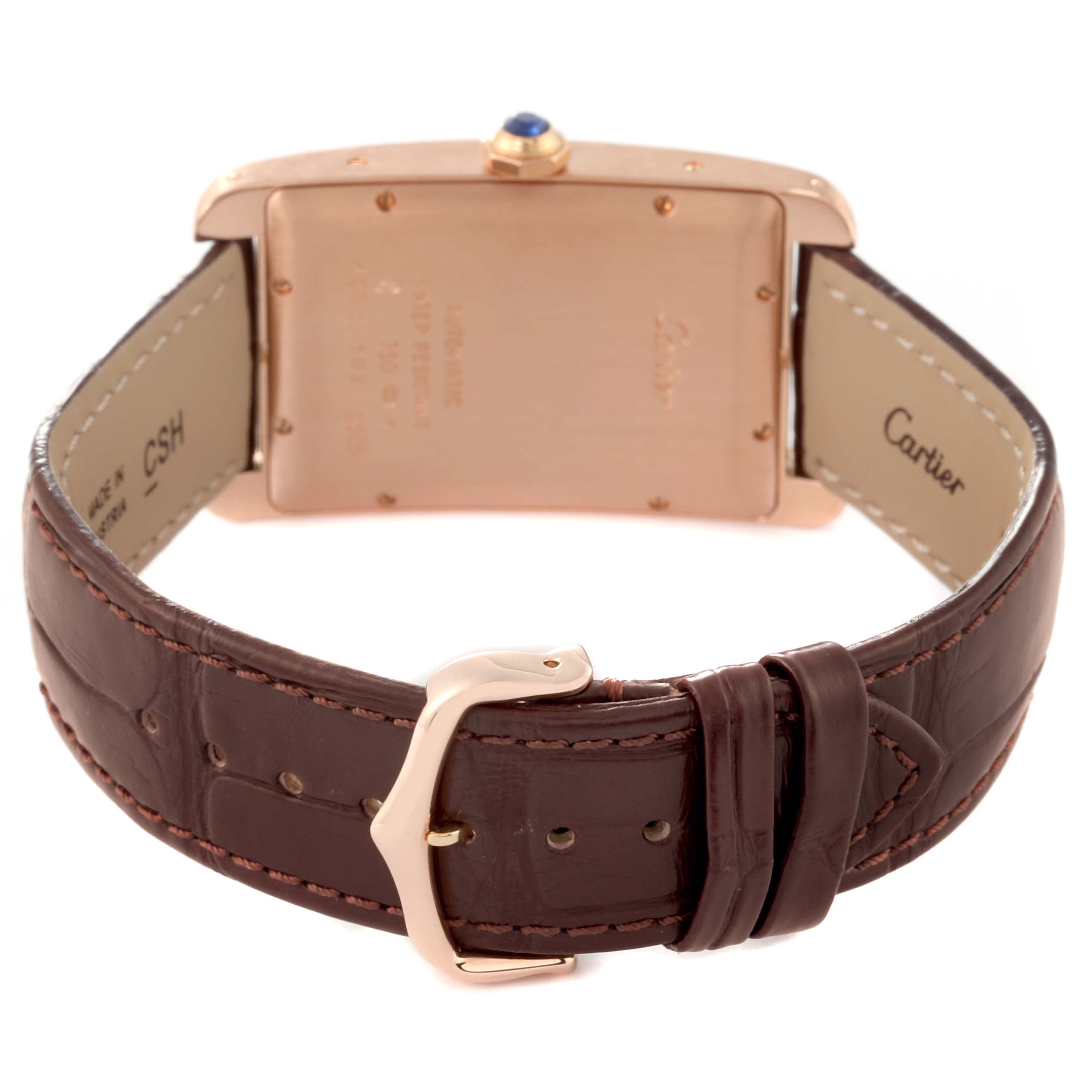 This image shows the back of a Cartier Tank Americaine W2609156 Men's Rose Gold Silver Dial W2609156 Men's Rose Gold Silver Dial watch, highlighting the strap, buckle, and back case.