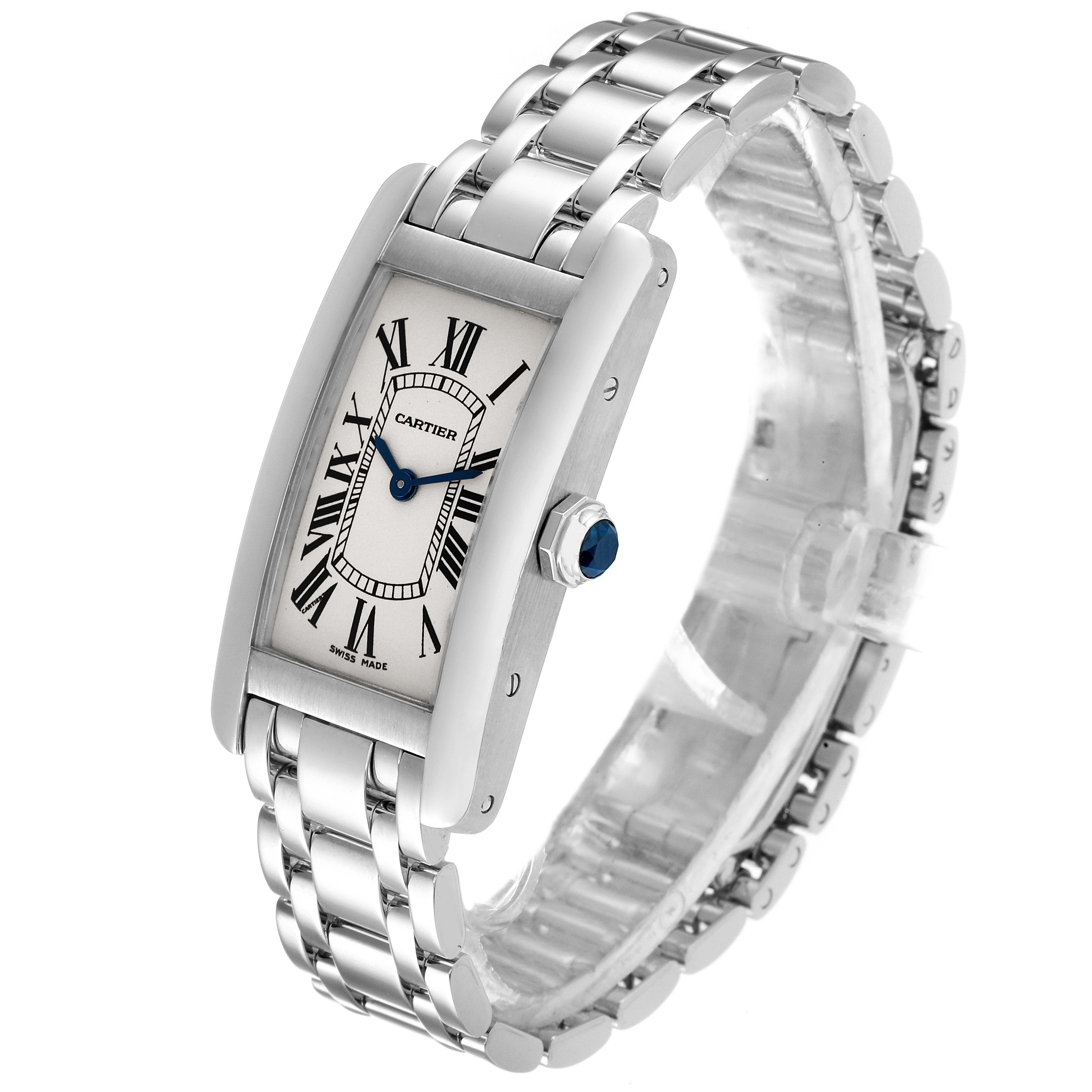 The image shows a Tank Americaine watch by Cartier, angled to display the face, crown, and metal bracelet.