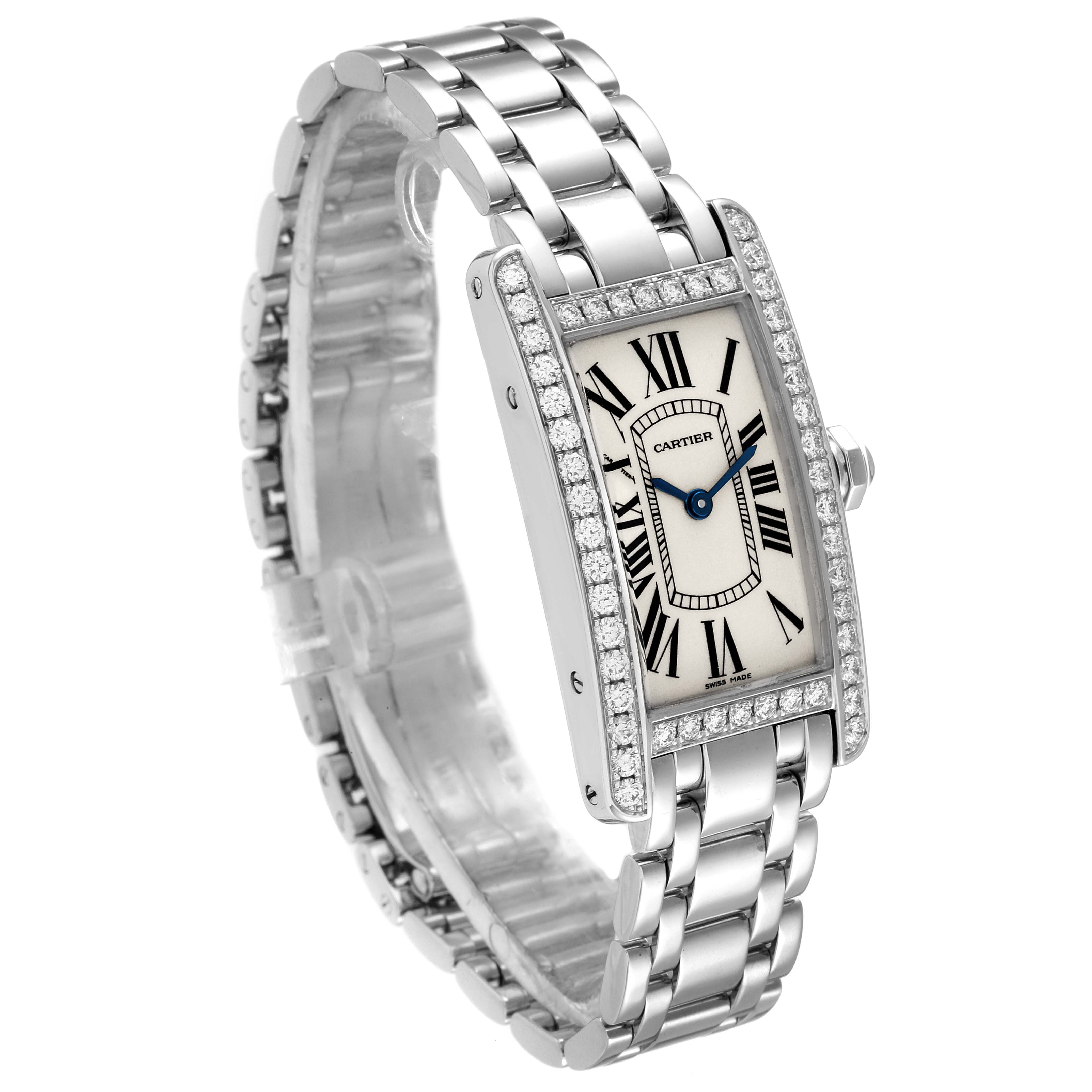 The Cartier Tank Americaine WB7018L1 Women
s White Gold Silver Dial WB7018L1 Women
s White Gold Silver Dial watch is shown at a three-quarter angle, displaying its diamond-set bezel, Roman numeral dial, and steel bracelet.