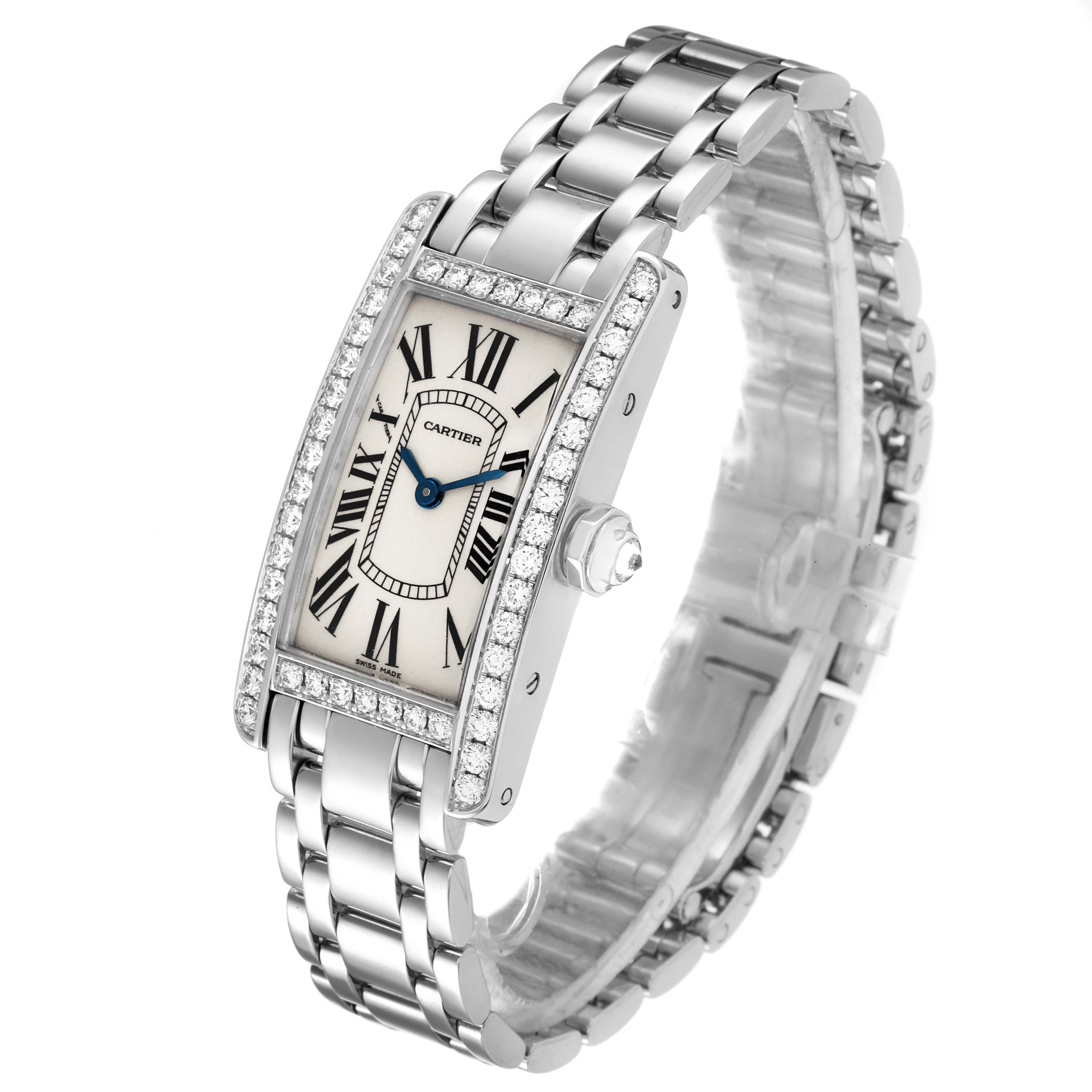The Cartier Tank Americaine WB7018L1 Women
s White Gold Silver Dial WB7018L1 Women
s White Gold Silver Dial watch is shown at an angled view, highlighting its rectangular face, diamond bezel, and metal bracelet.
