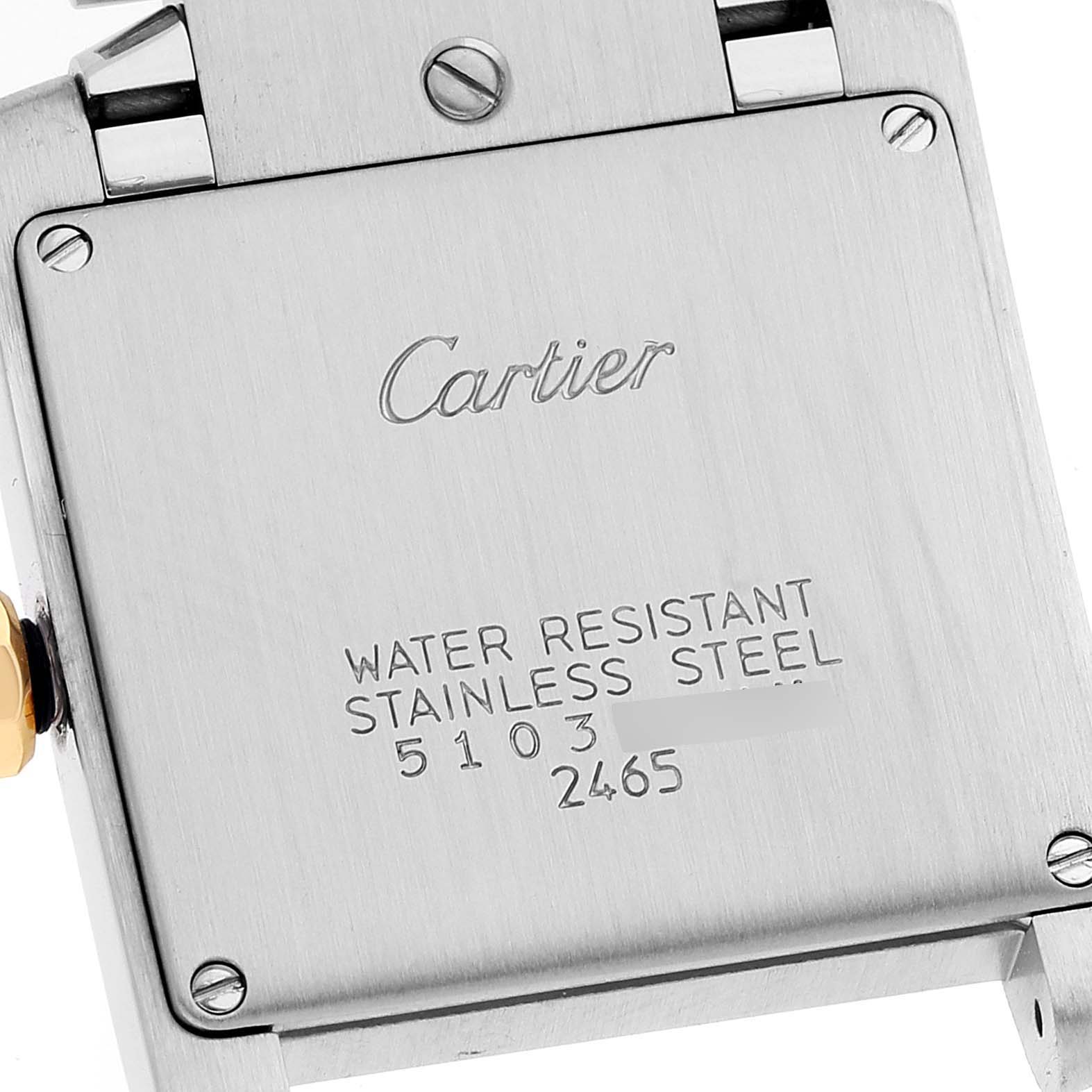 The image shows the case back of the Cartier Tank Francaise W51012Q4 Women's Steel and Gold (two tone) Silver Dial W51012Q4 Women's Steel and Gold (two tone) Silver Dial watch, including screws and engraved text.