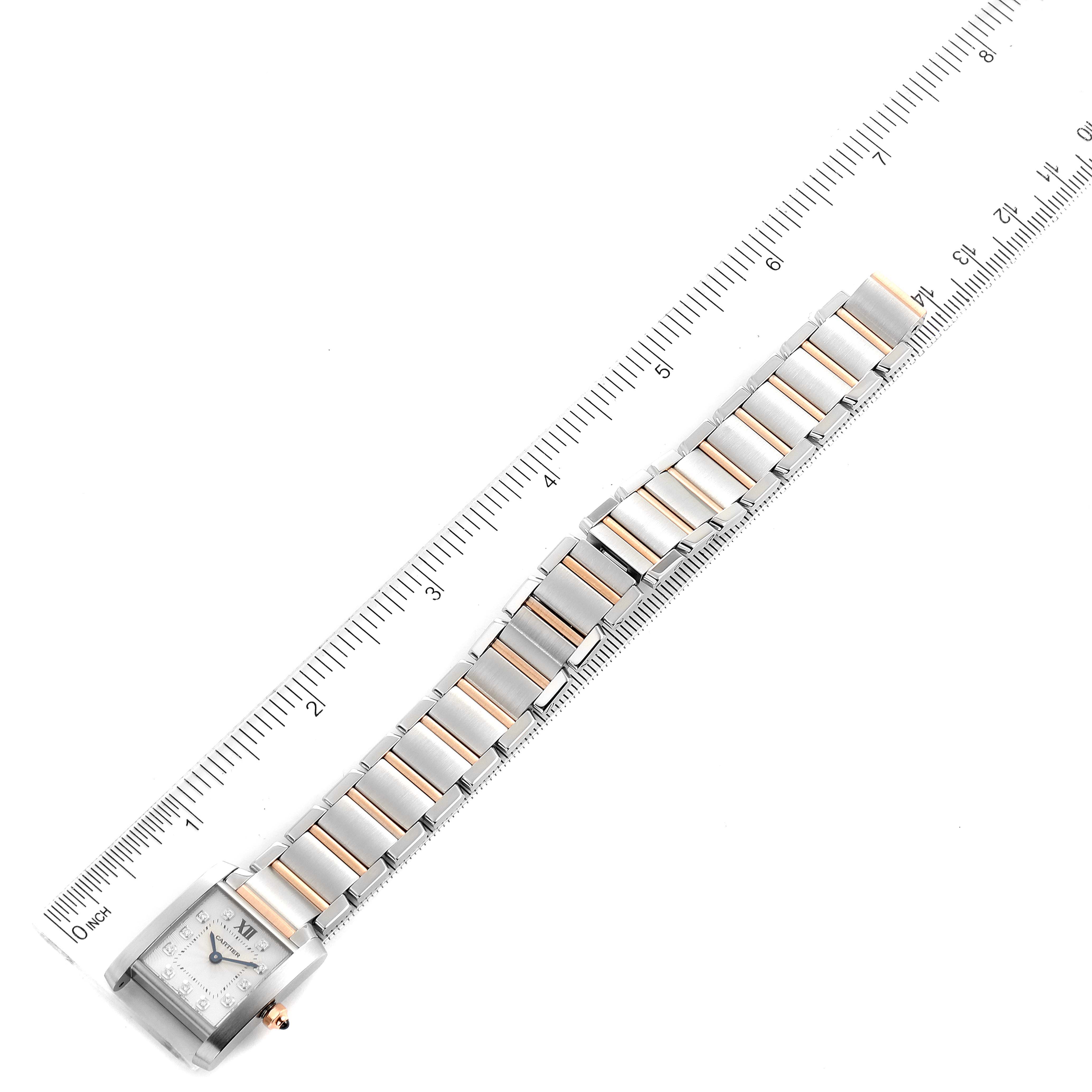 The image shows the fully extended bracelet and case of a Cartier Tank Francaise WE110004 Women's Steel and Gold (two tone) Silver Dial WE110004 Women's Steel and Gold (two tone) Silver Dial watch, measured against a ruler.