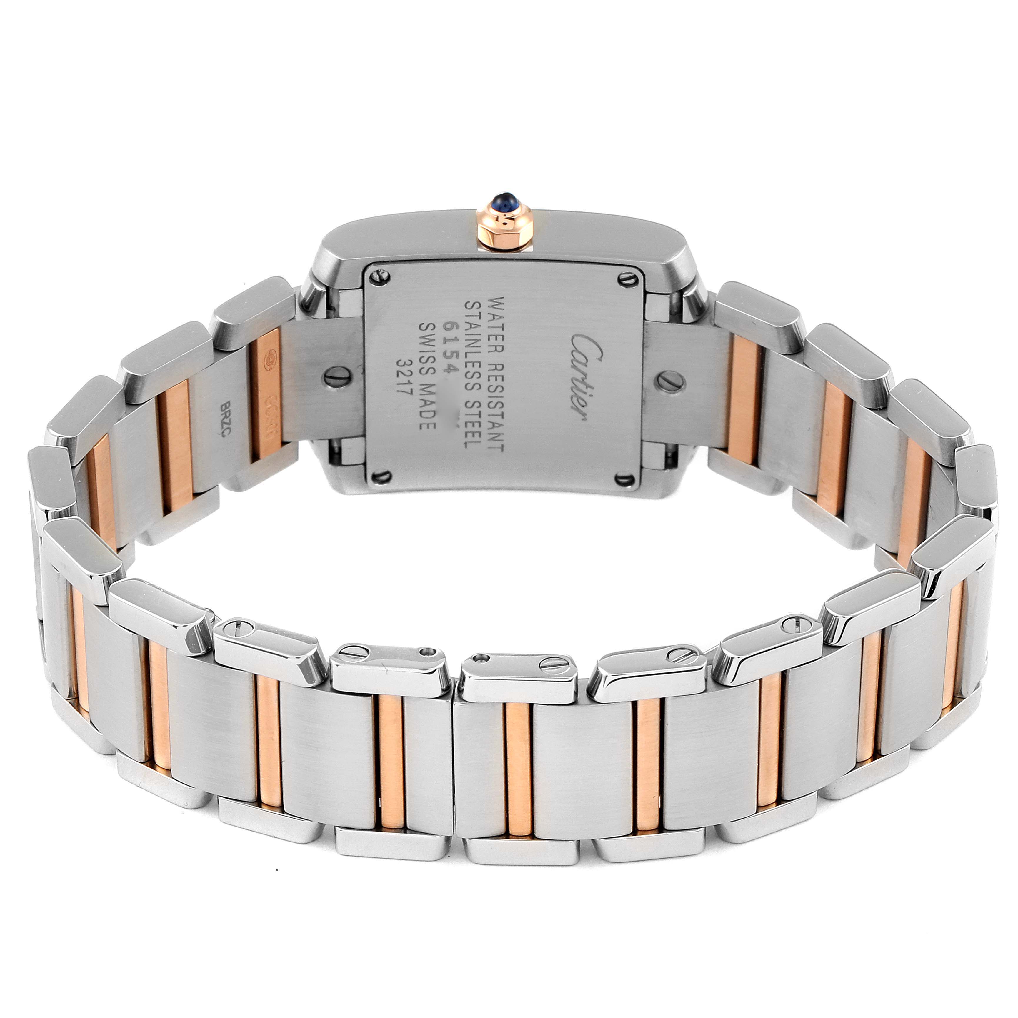 The image shows the back of a Cartier Tank Française watch, focusing on the stainless steel and rose gold bracelet link.