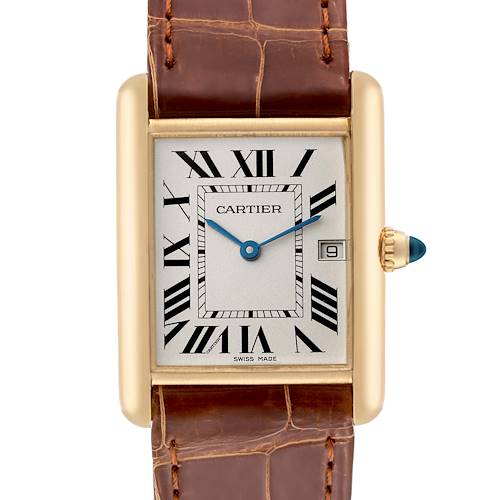 This image shows the face and top part of the brown leather strap of the Cartier Tank Louis model watch, including the crown with a blue gemstone.