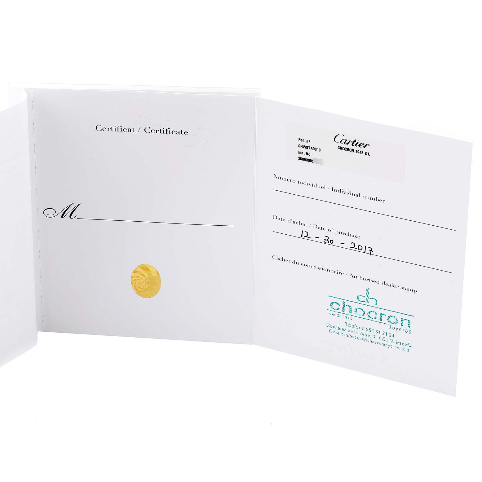 The image displays the certificate of authenticity and warranty booklet for a Cartier Tank MC WSTA0010 Men's Stainless Steel Blue Dial WSTA0010 Men's Stainless Steel Blue Dial model watch.