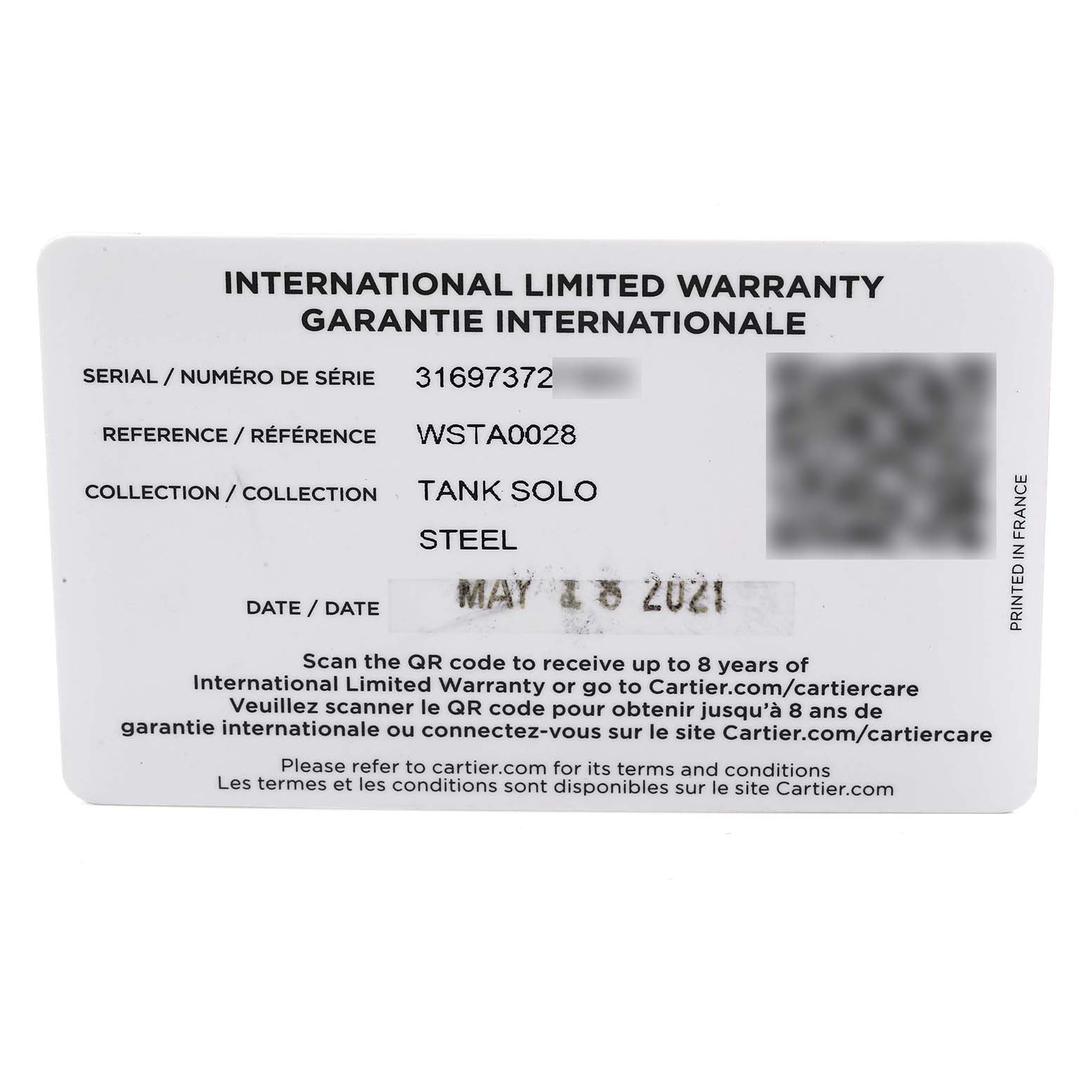 The image shows the international limited warranty card for a Tank Solo model by Cartier, displaying serial number, reference, and warranty information.