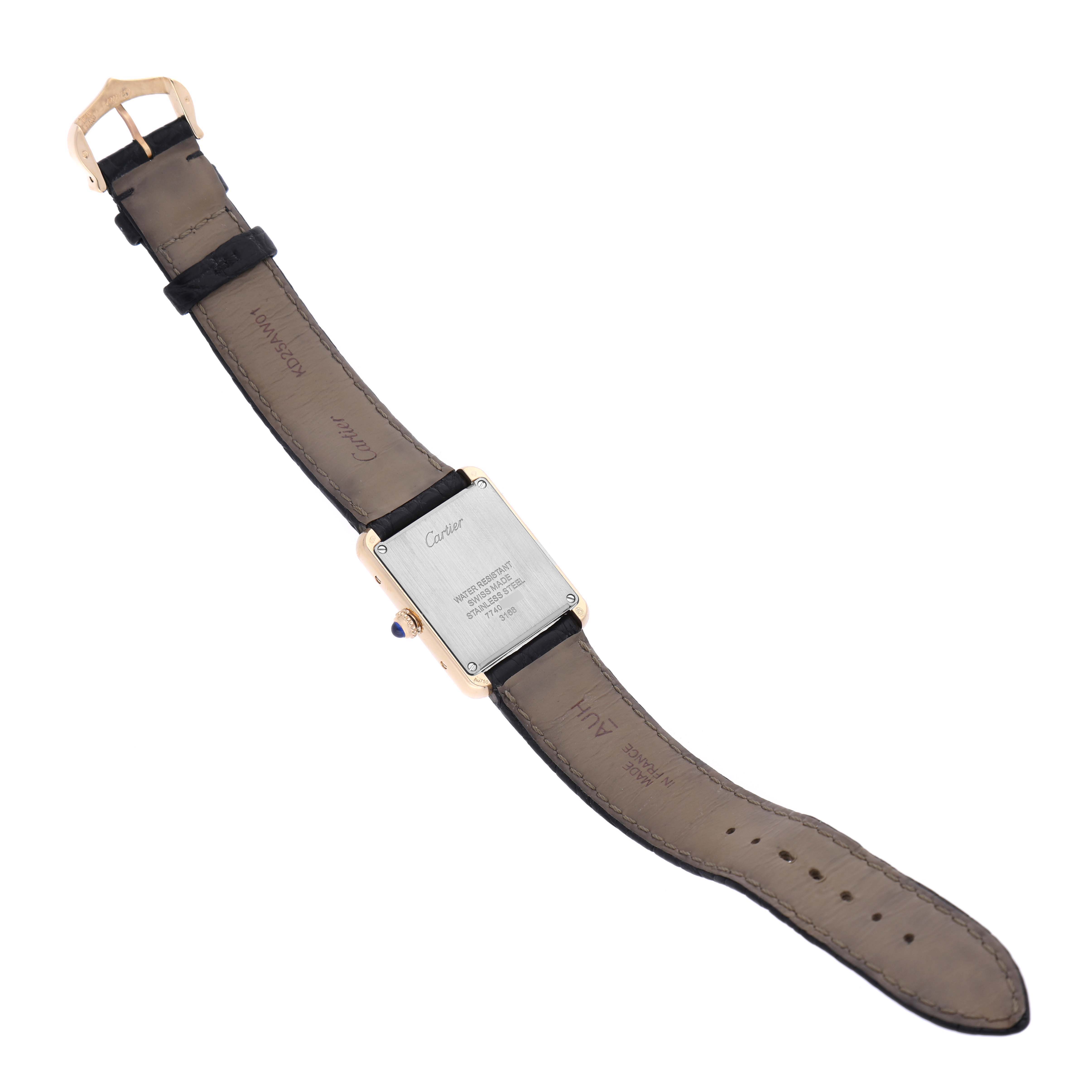 The image shows the back of a Cartier Tank Solo W5200002 Women's Steel and Gold (two tone) Silver Dial W5200002 Women's Steel and Gold (two tone) Silver Dial watch, including the case back, straps, and buckle.