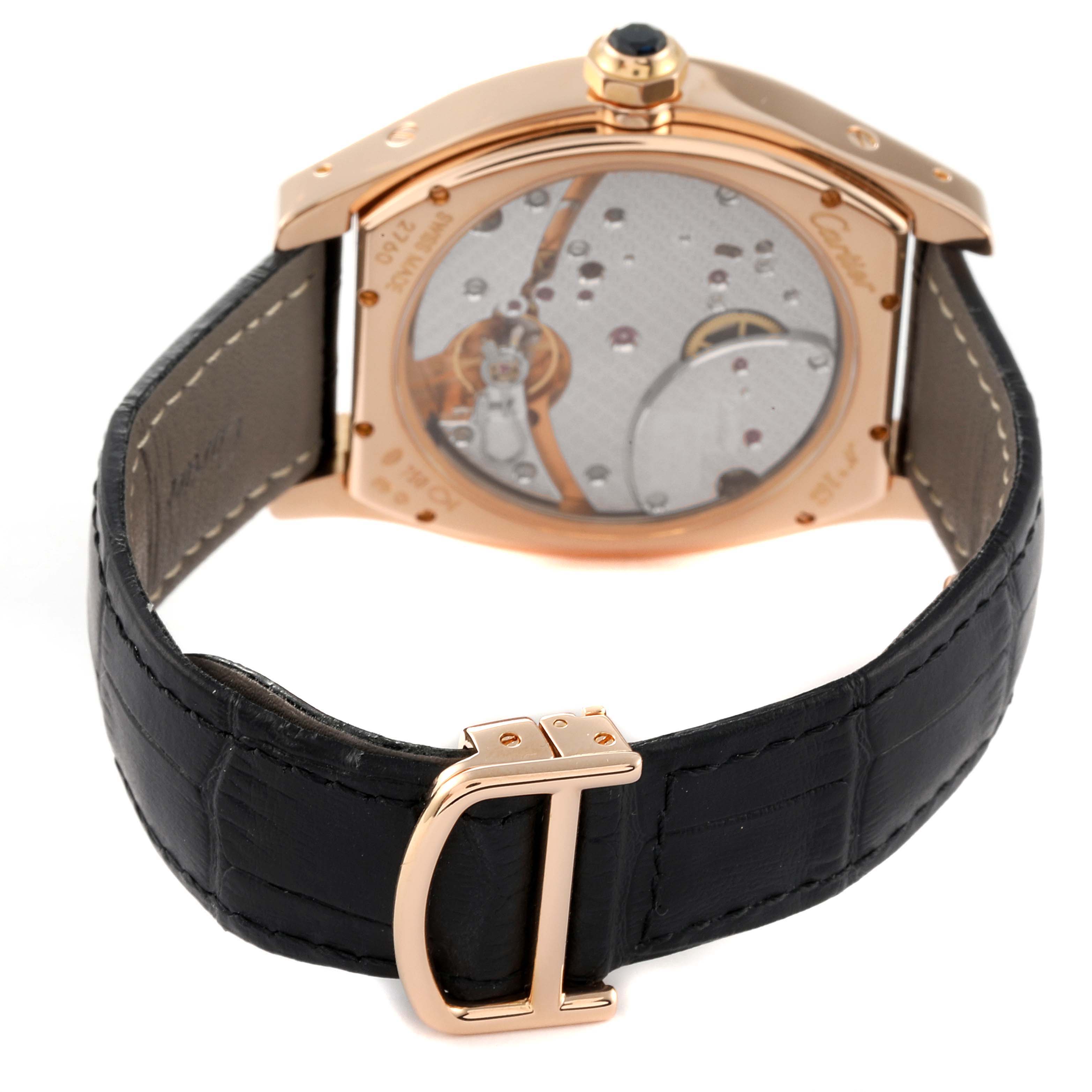 The image shows the back view of a Cartier Tortue W1545851 Men's Rose Gold Silver Dial W1545851 Men's Rose Gold Silver Dial watch, highlighting its movement and leather strap with a buckle.
