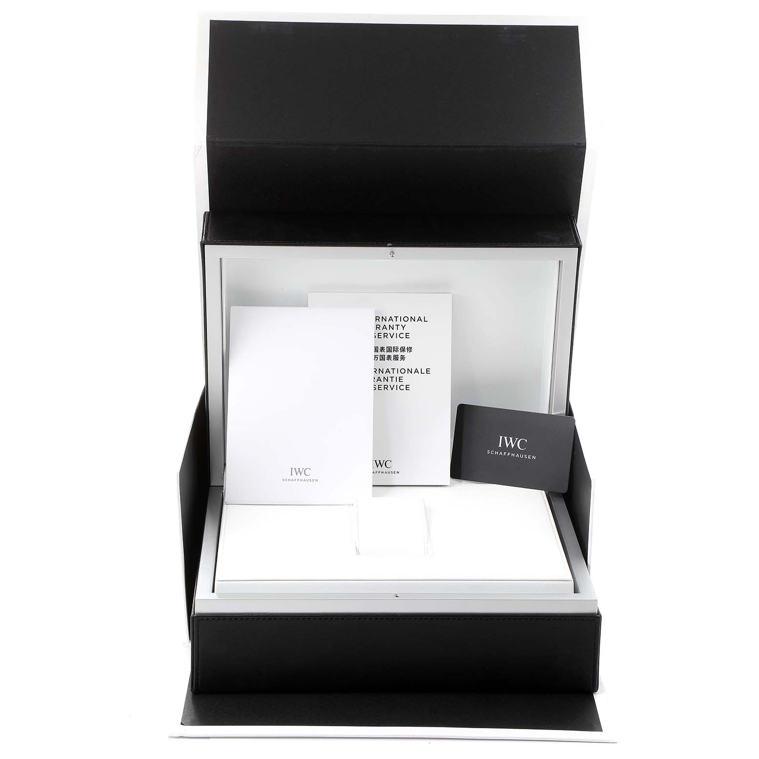 This image shows the packaging contents for an IWC Pilot IW389002 Men's Ceramic Black Dial IW389002 Men's Ceramic Black Dial model watch, including the box, instruction manuals, and cards.