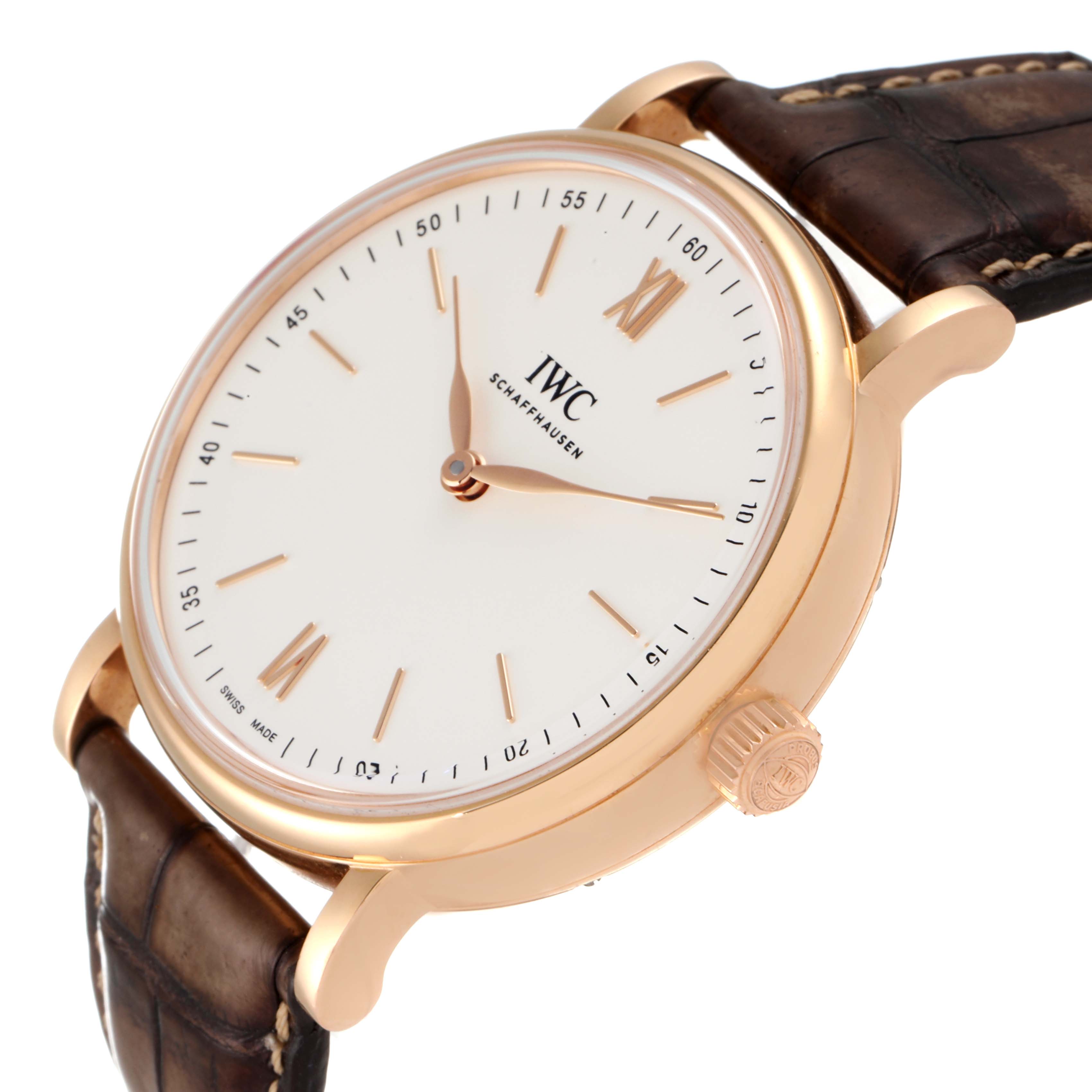 The IWC Portofino IW511101 Men's Rose Gold Silver Dial IW511101 Men's Rose Gold Silver Dial watch is shown at an angle, highlighting the dial, crown, and brown leather strap.
