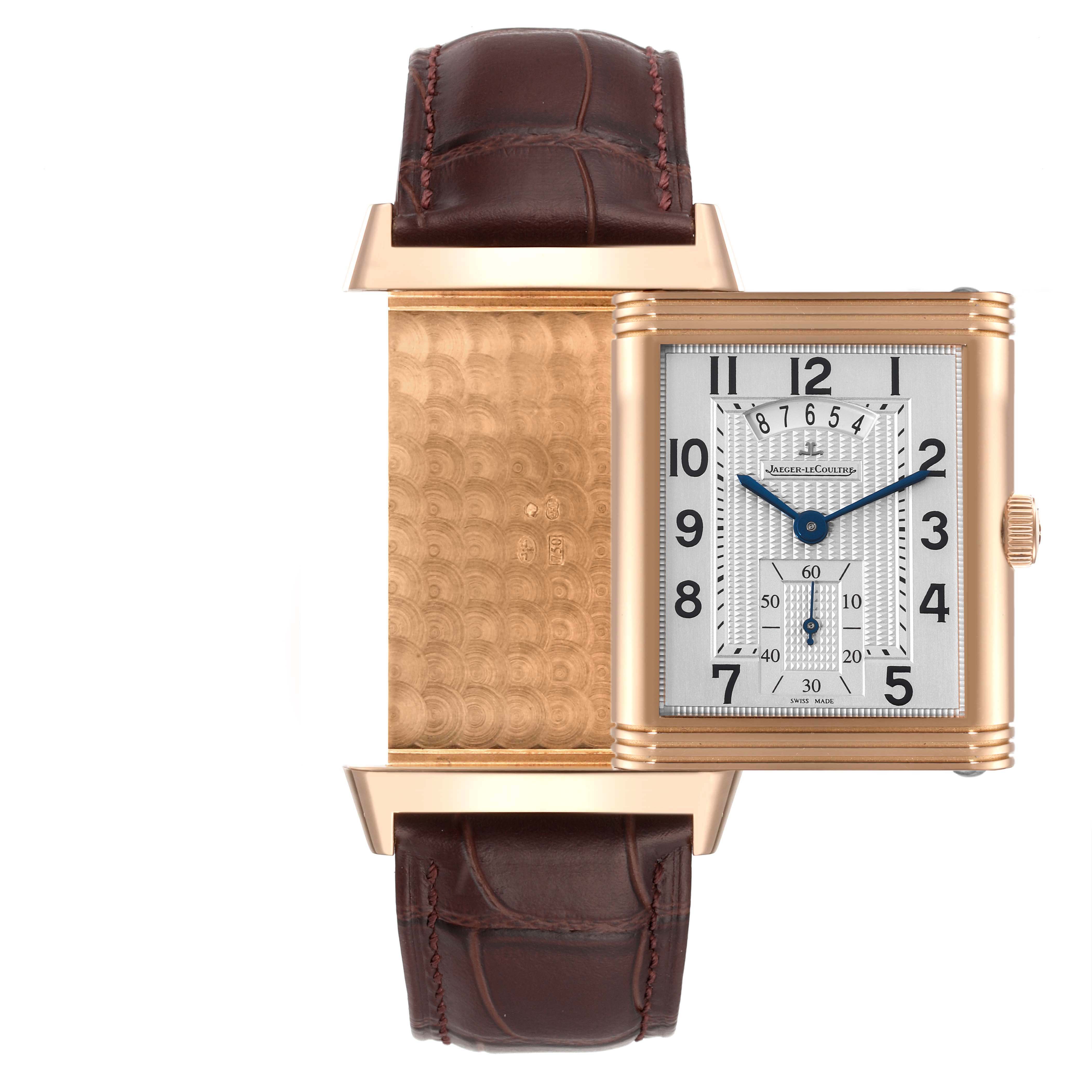 The image shows a Jaeger-LeCoultre Reverso watch at a front view, partially flipped to display the engraved back.