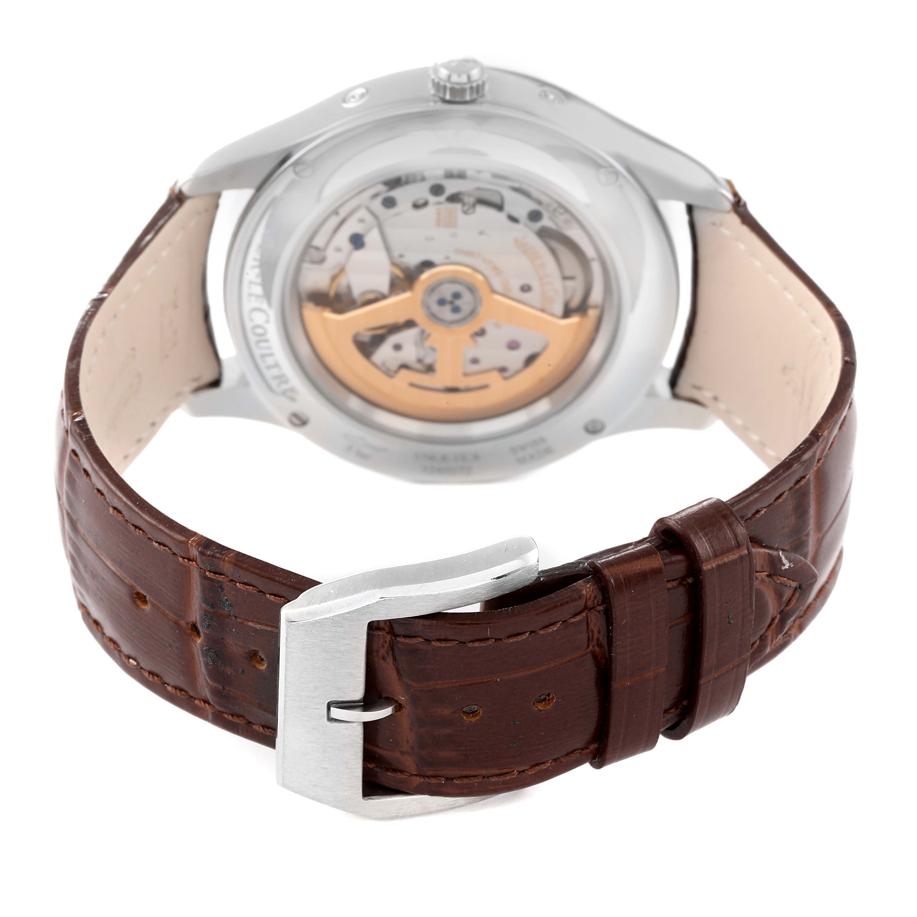 The image shows the back view of a Jaeger-LeCoultre Master model watch, highlighting its movement and leather strap with buckle.