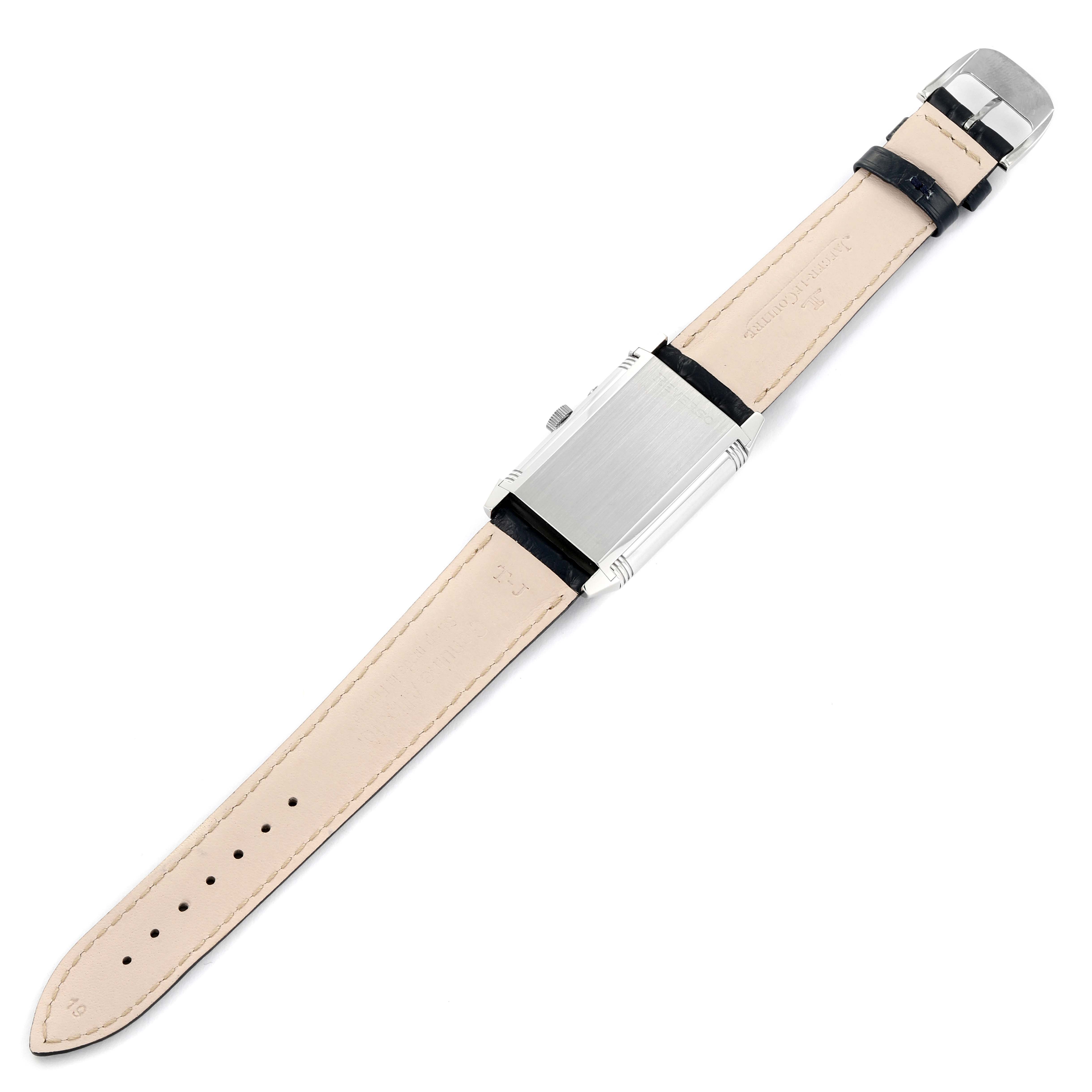 The image shows the back, buckle, and leather strap of a Jaeger-LeCoultre Reverso watch, seen lying flat.