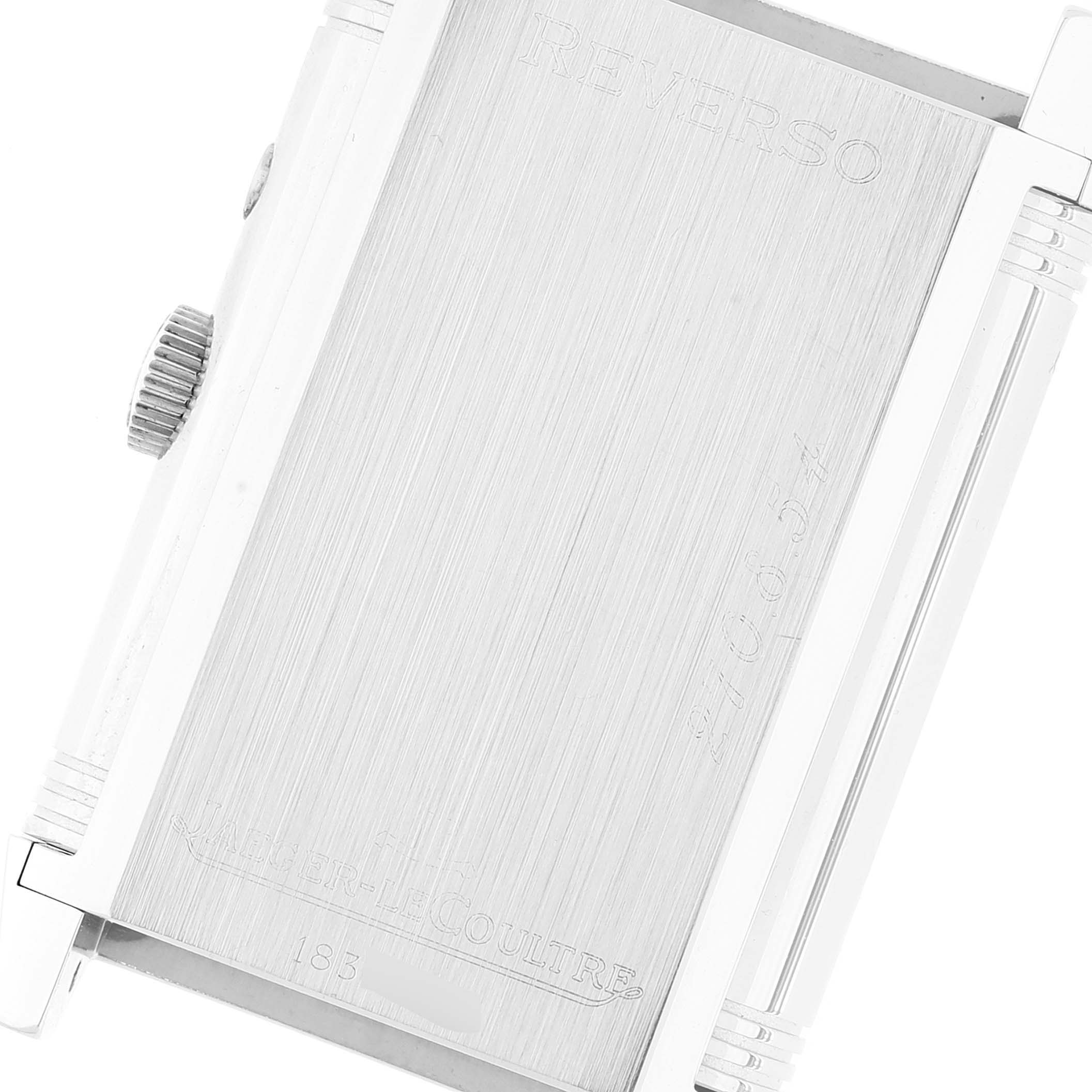 The image shows the back of a Jaeger-LeCoultre Reverso watch, including the case and crown.